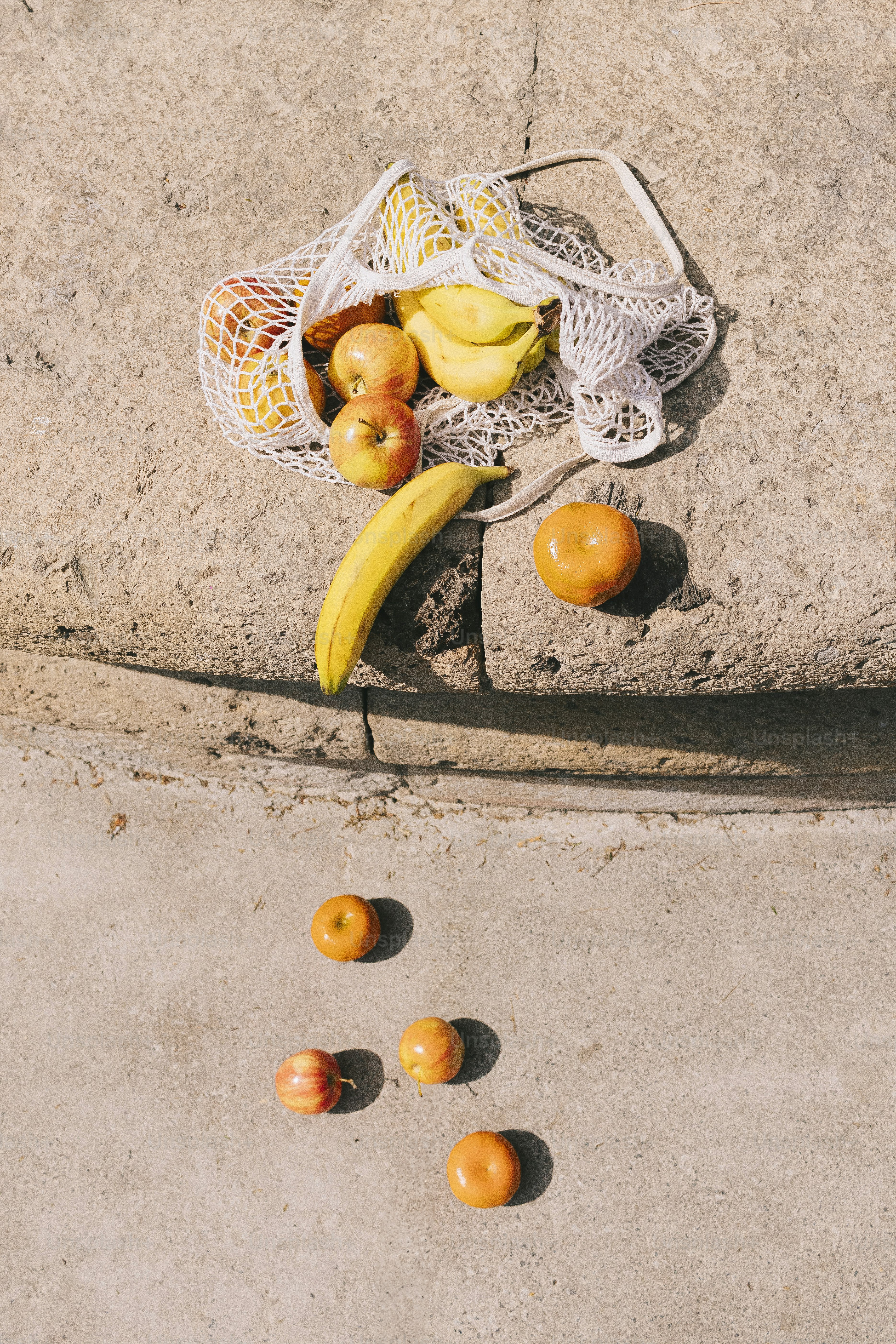 A bunch of fruit that is sitting on the ground