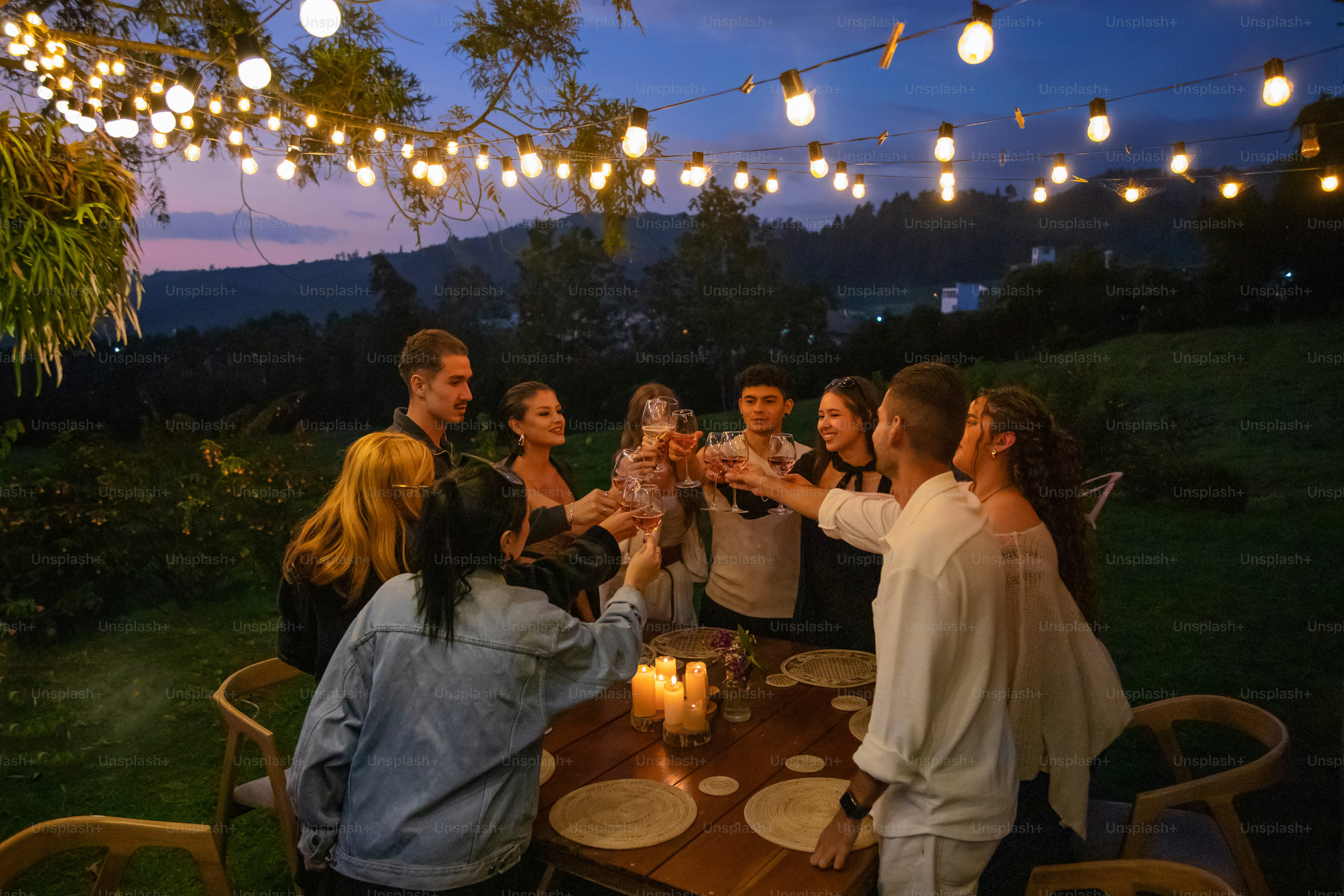 A group of people standing around a table photo – Outdoor Image on Unsplash