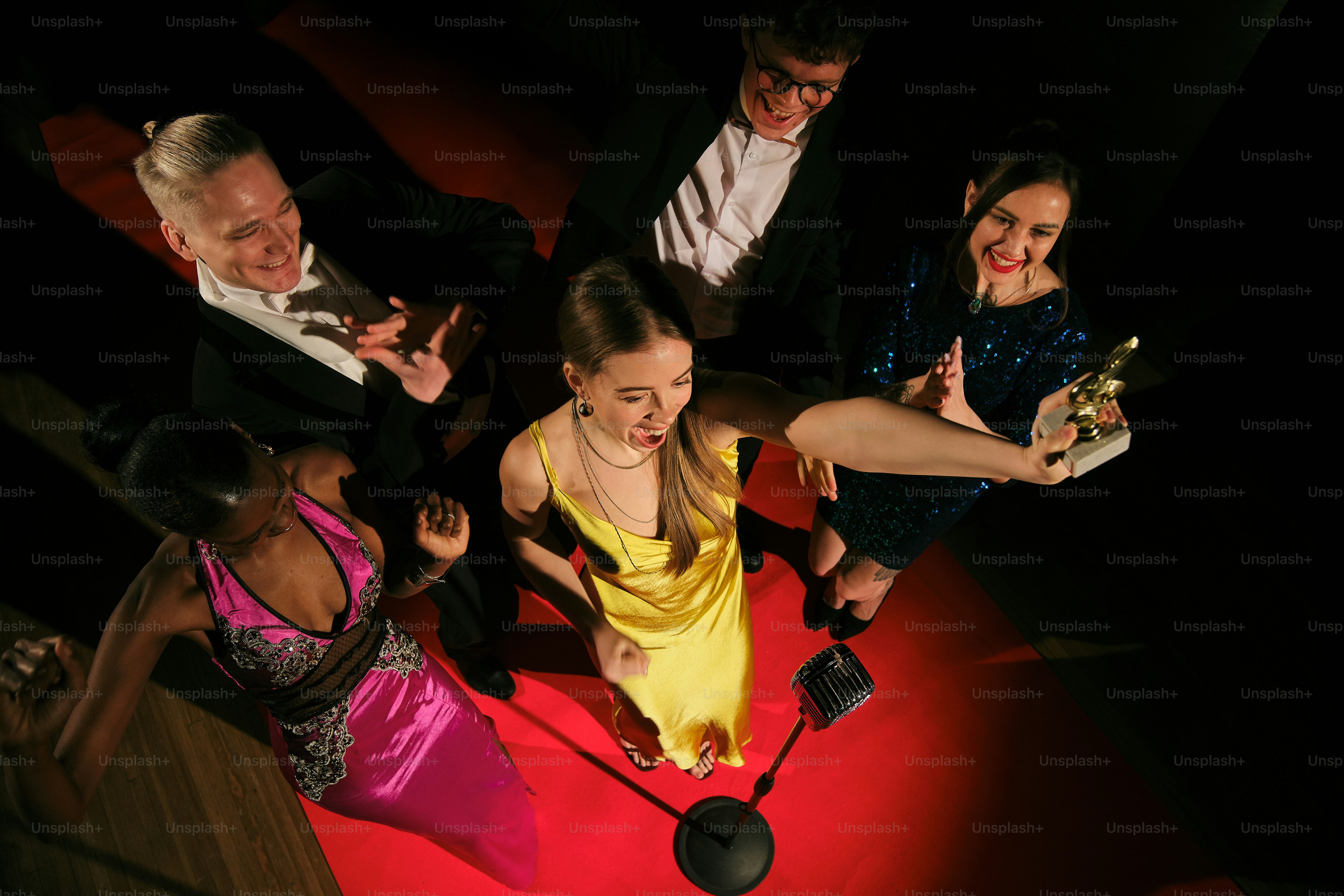 A group of people standing around each other