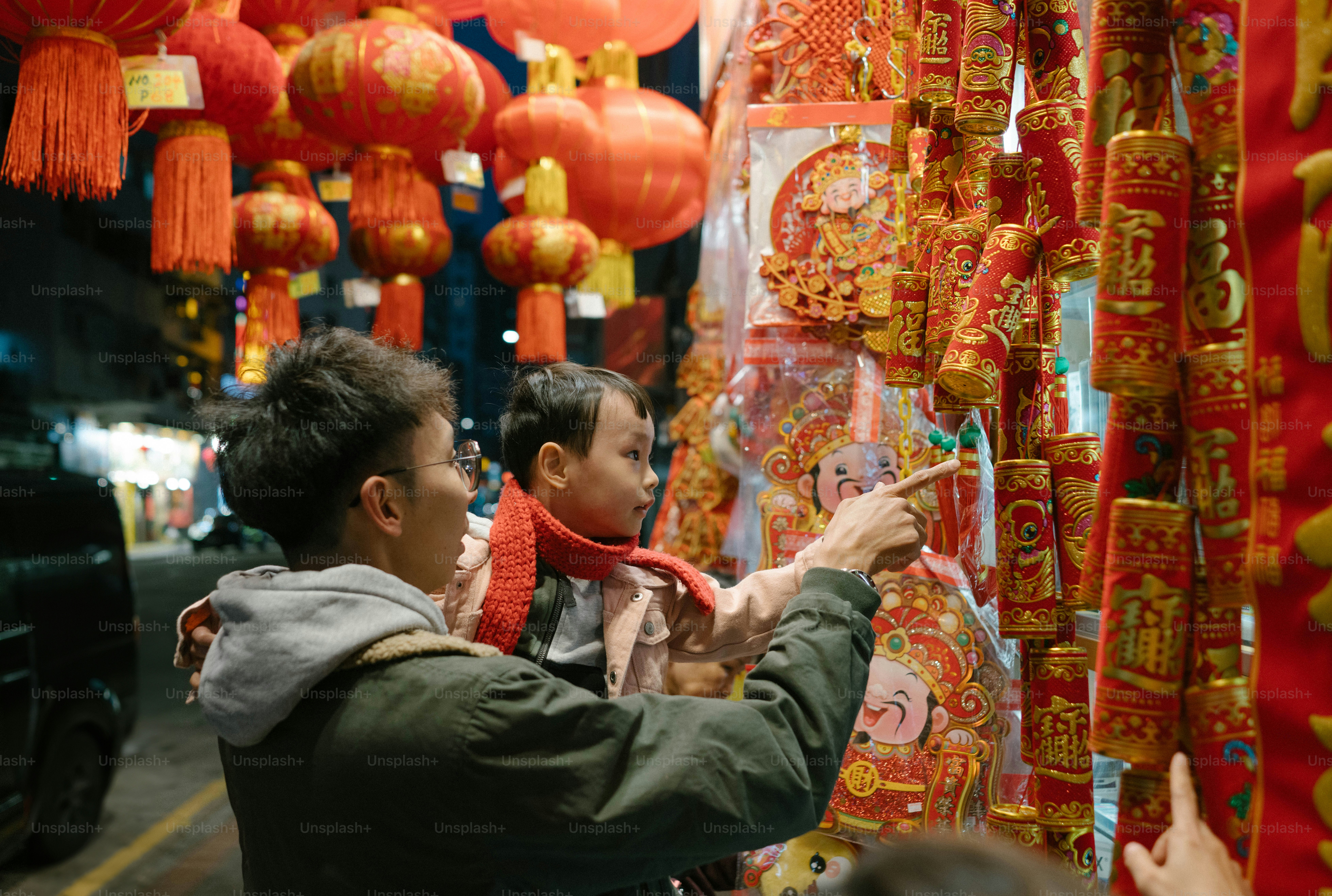 A couple of people that are looking at some decorations