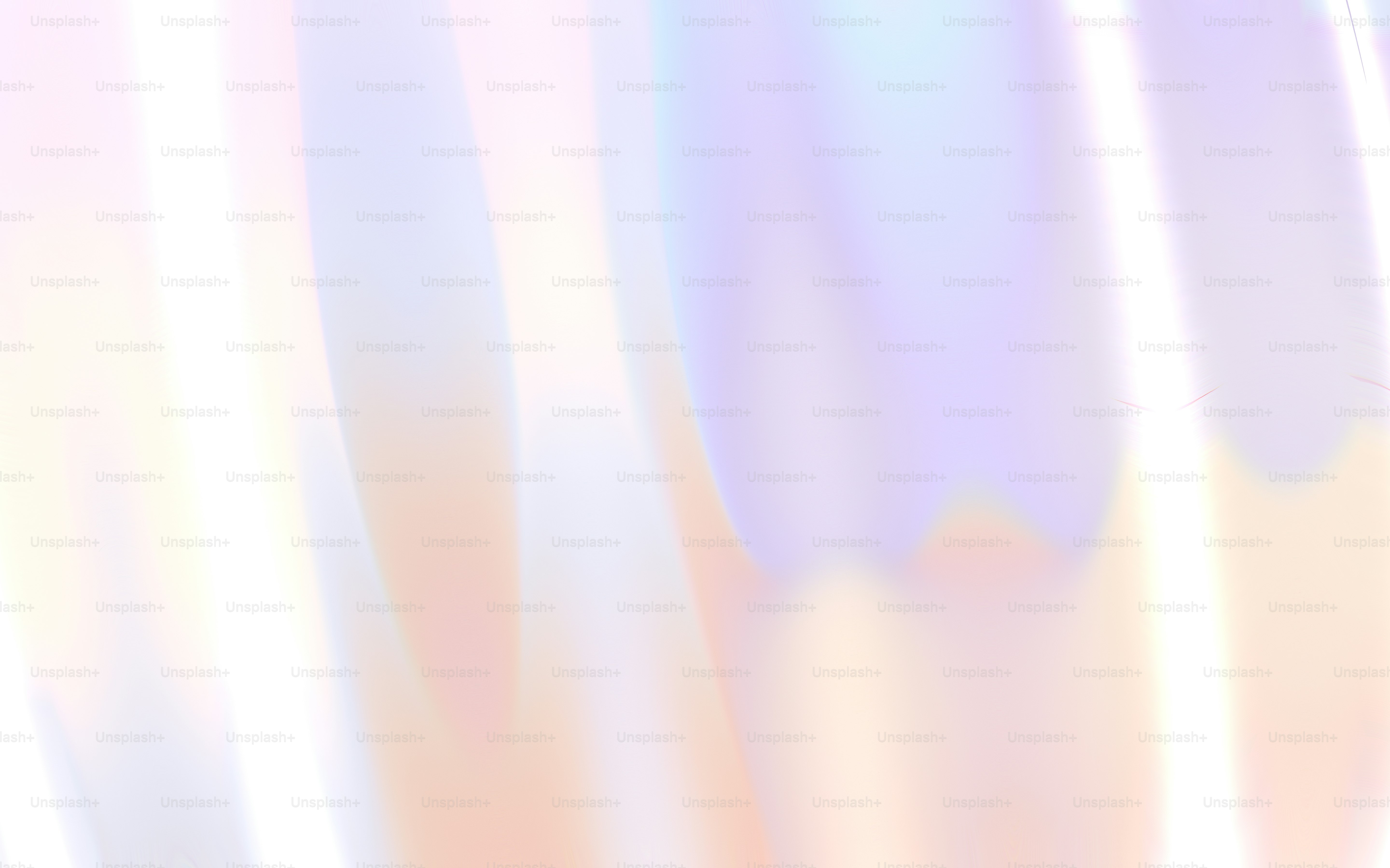A blurry image of a pink and blue background