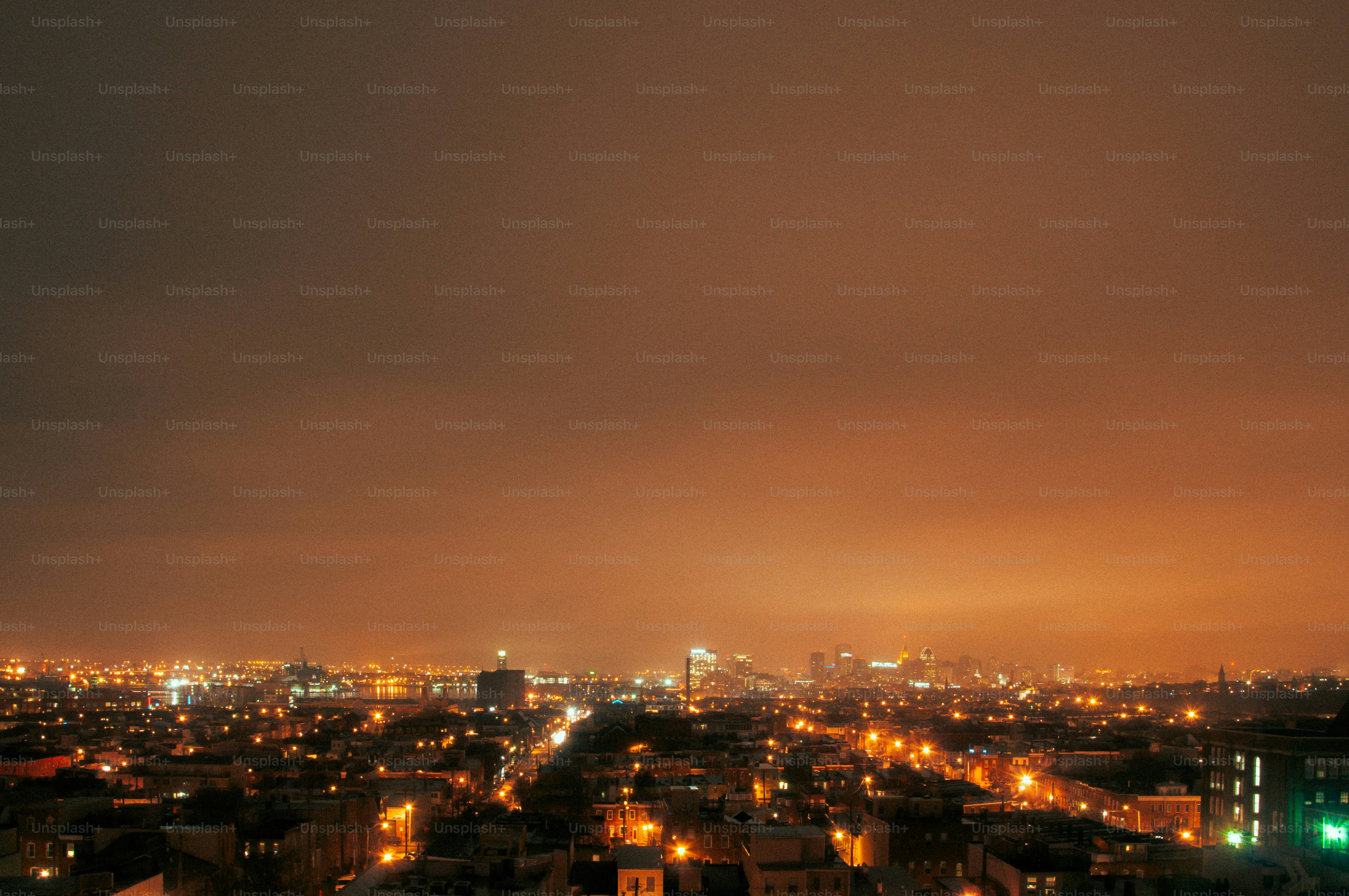 A view of a city at night from the top of a building