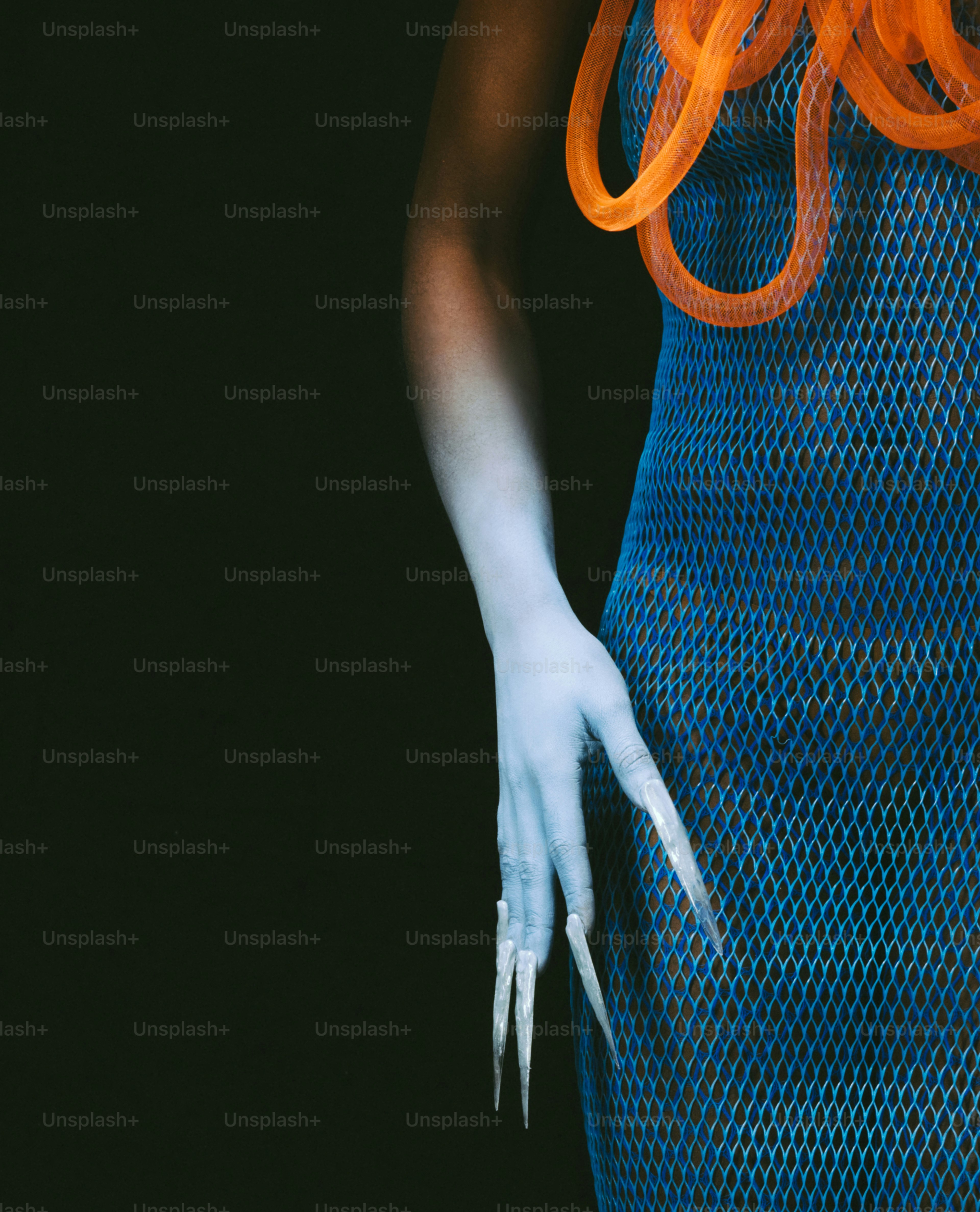 A woman in a blue dress with orange hair