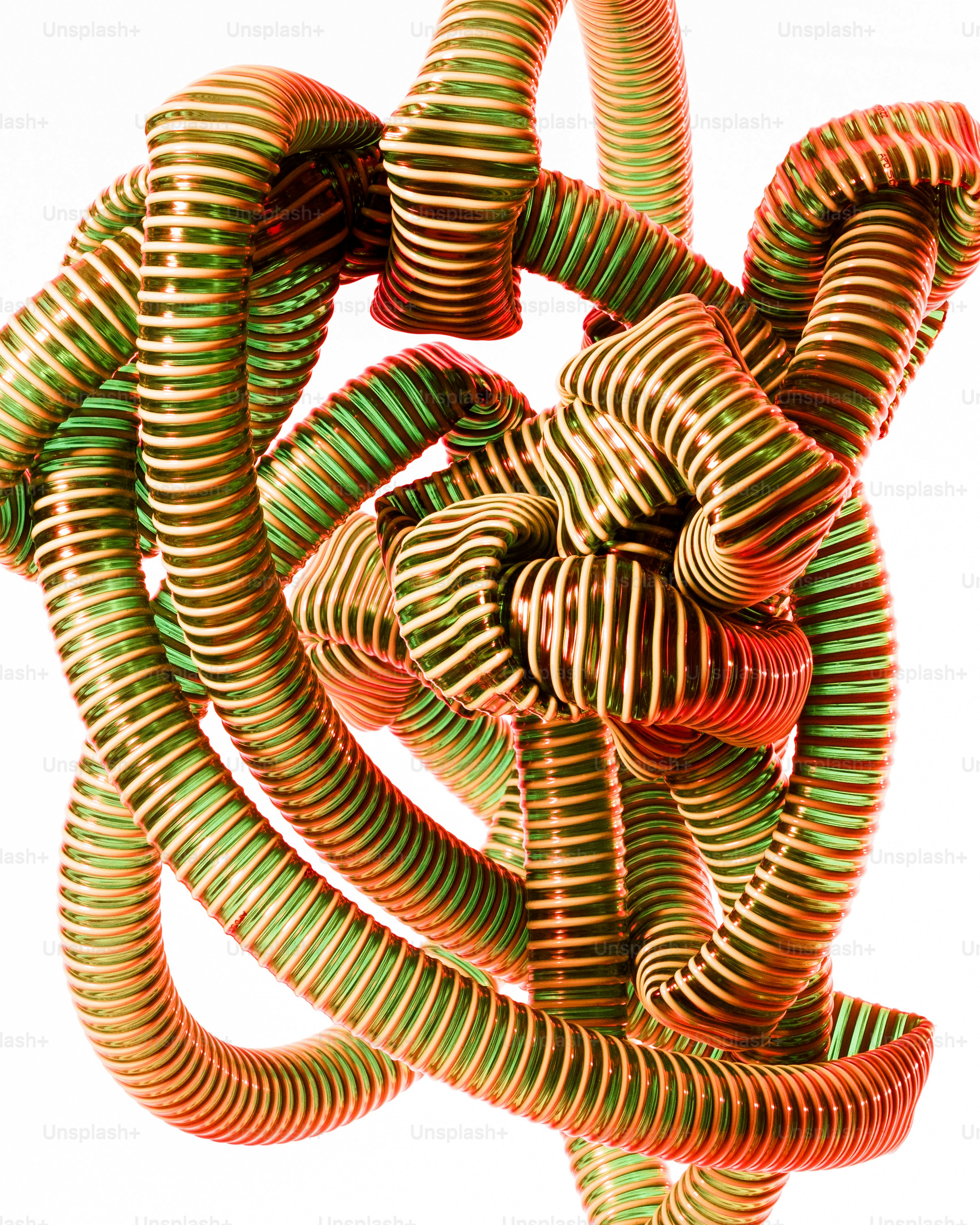 A group of green and orange spirals on a white background