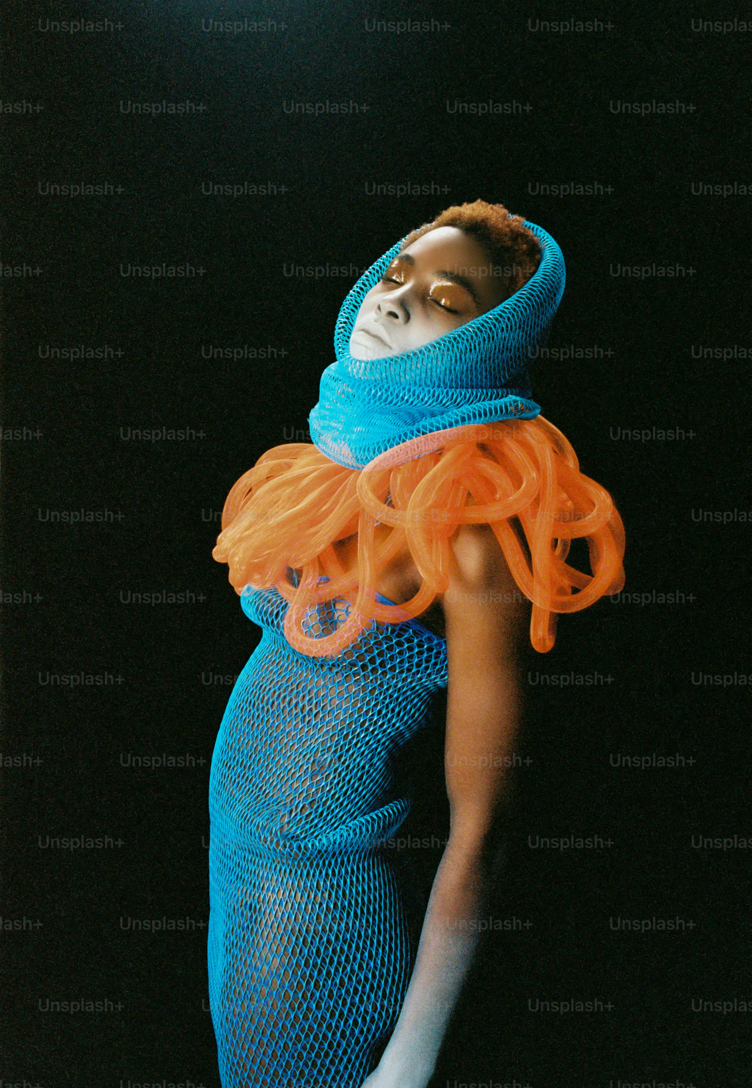 A woman with orange hair and a blue dress