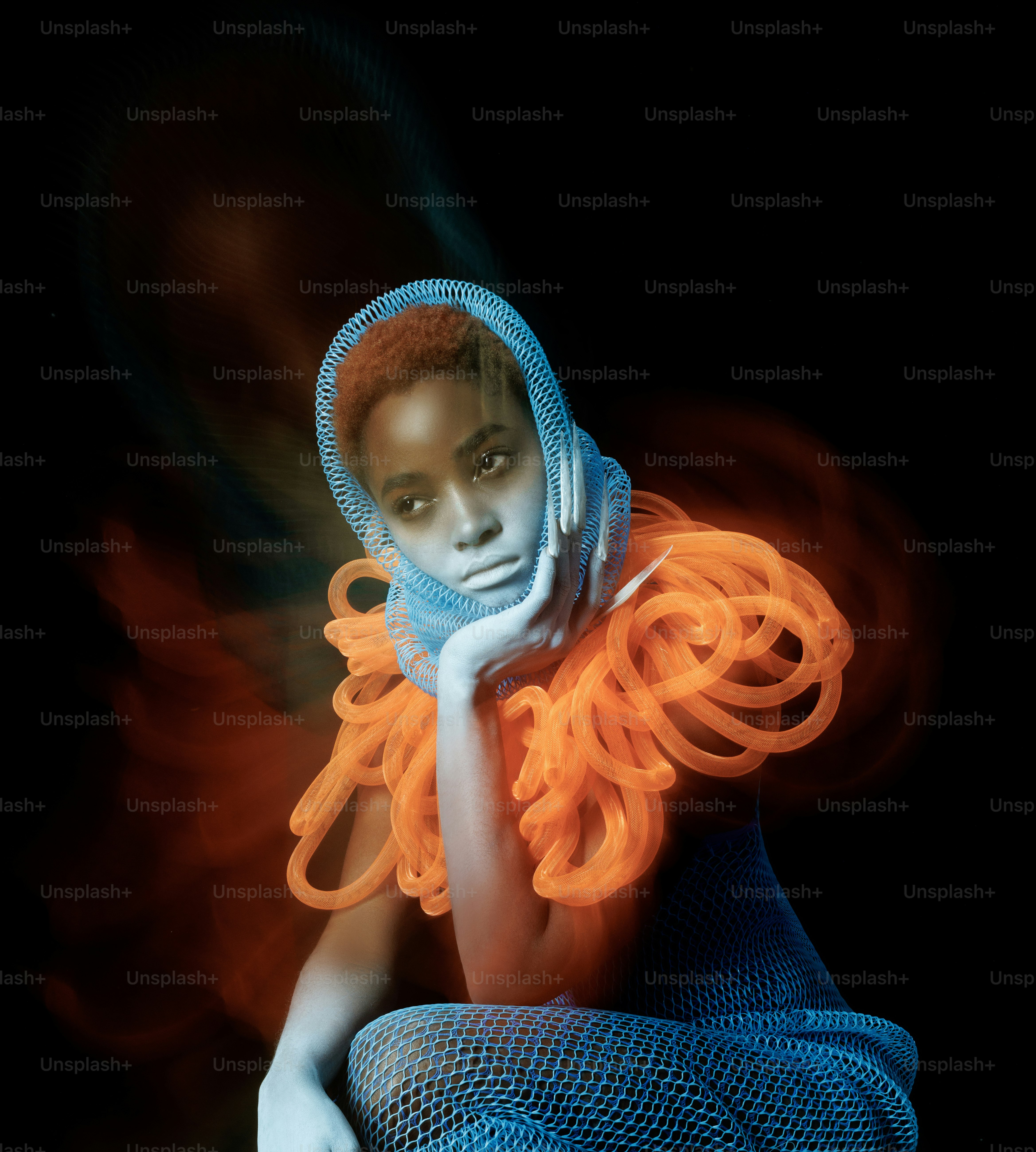 A woman in a blue dress with orange hair