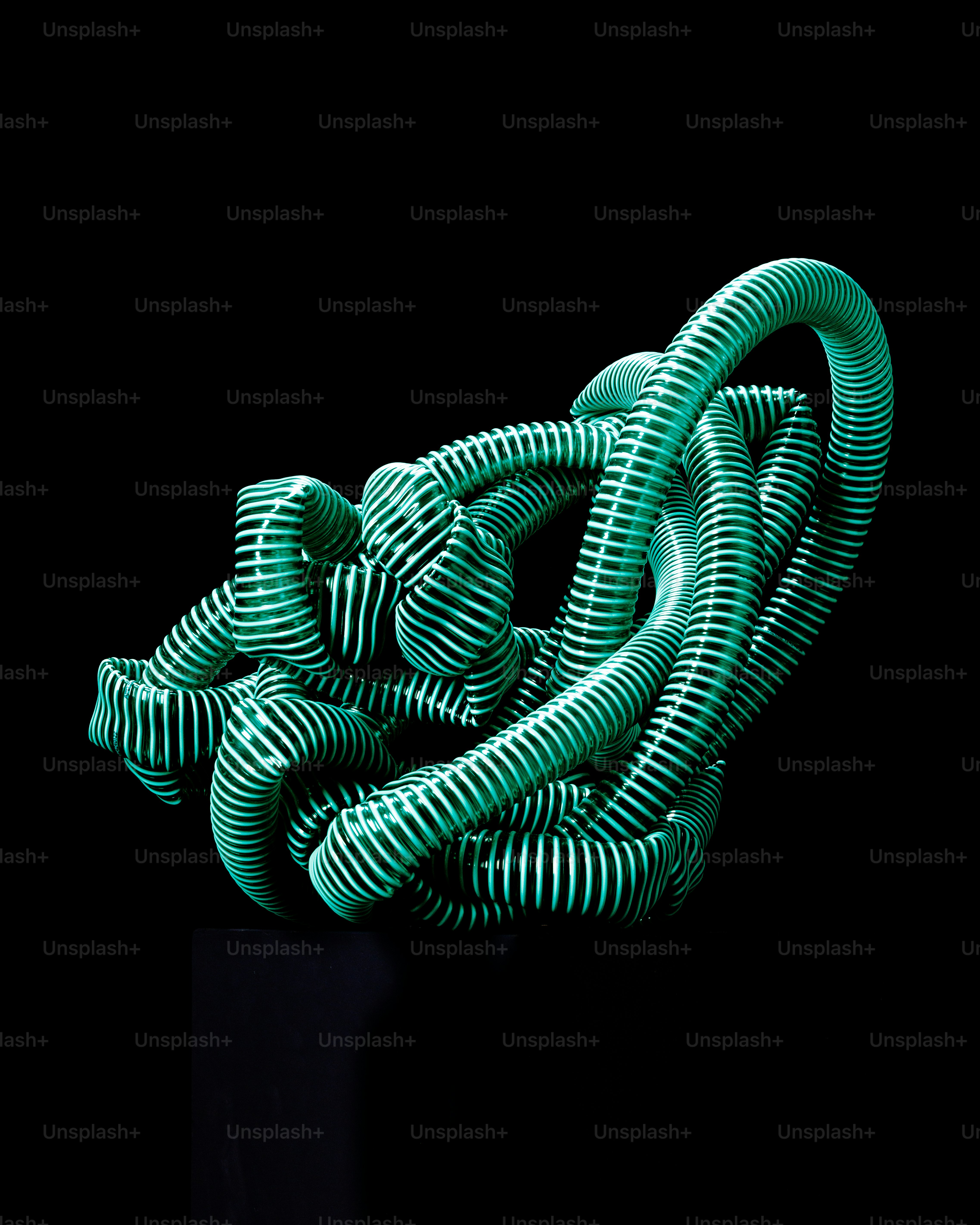 A green object is sitting on a black surface