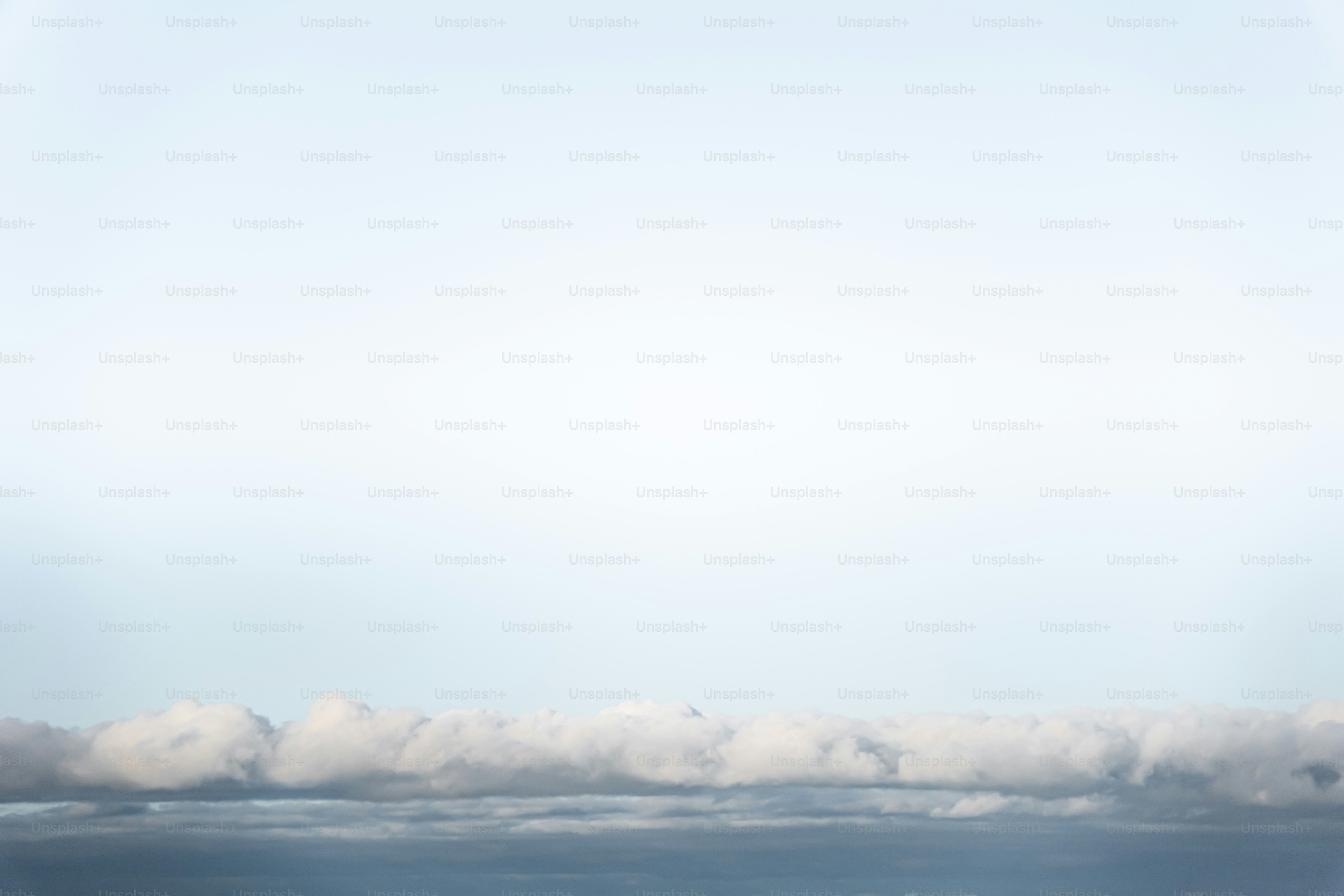 A plane flying over a body of water photo – Beach Image on Unsplash