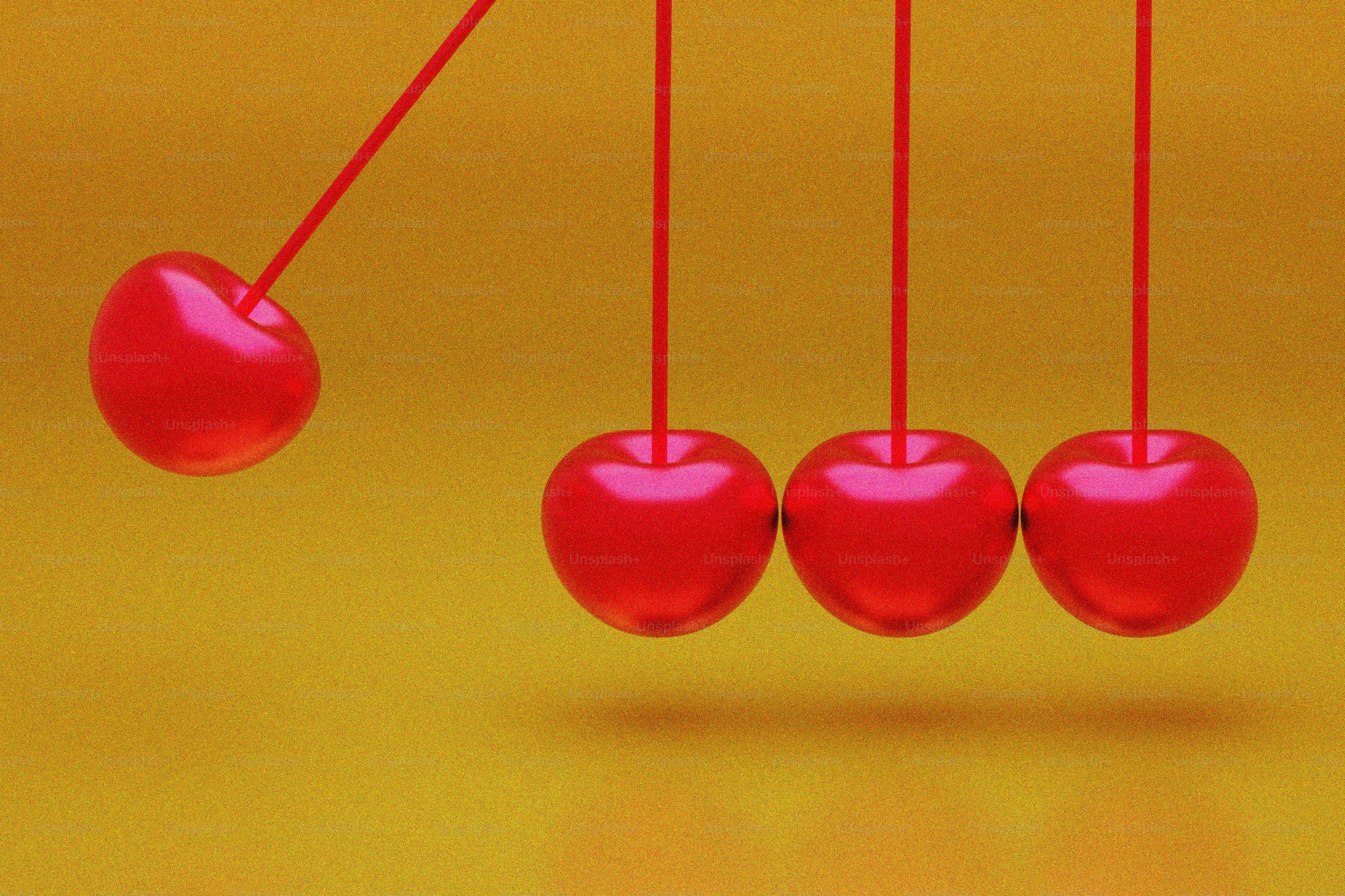 A group of cherries hanging from a string