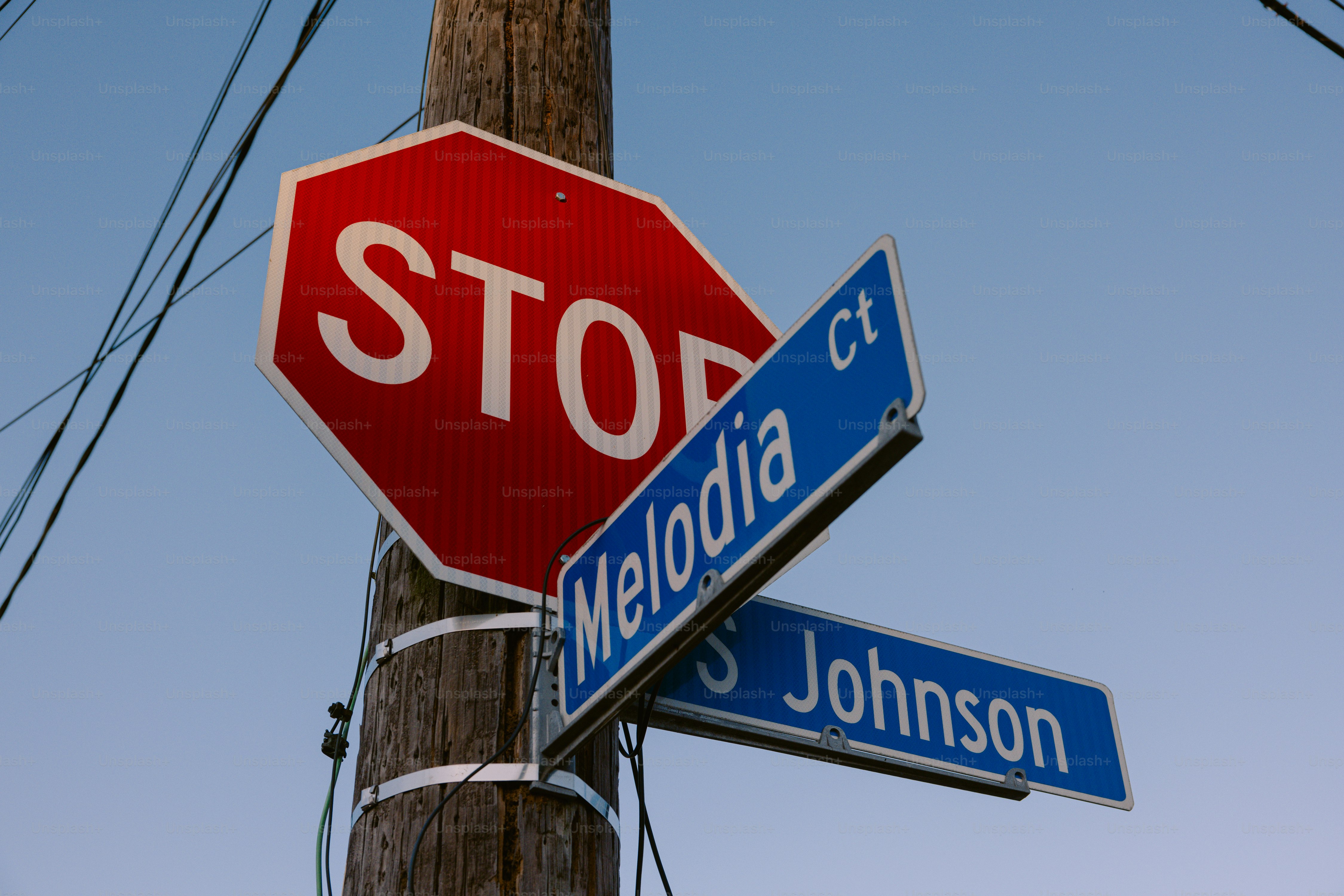 A stop sign and a street sign on a pole
