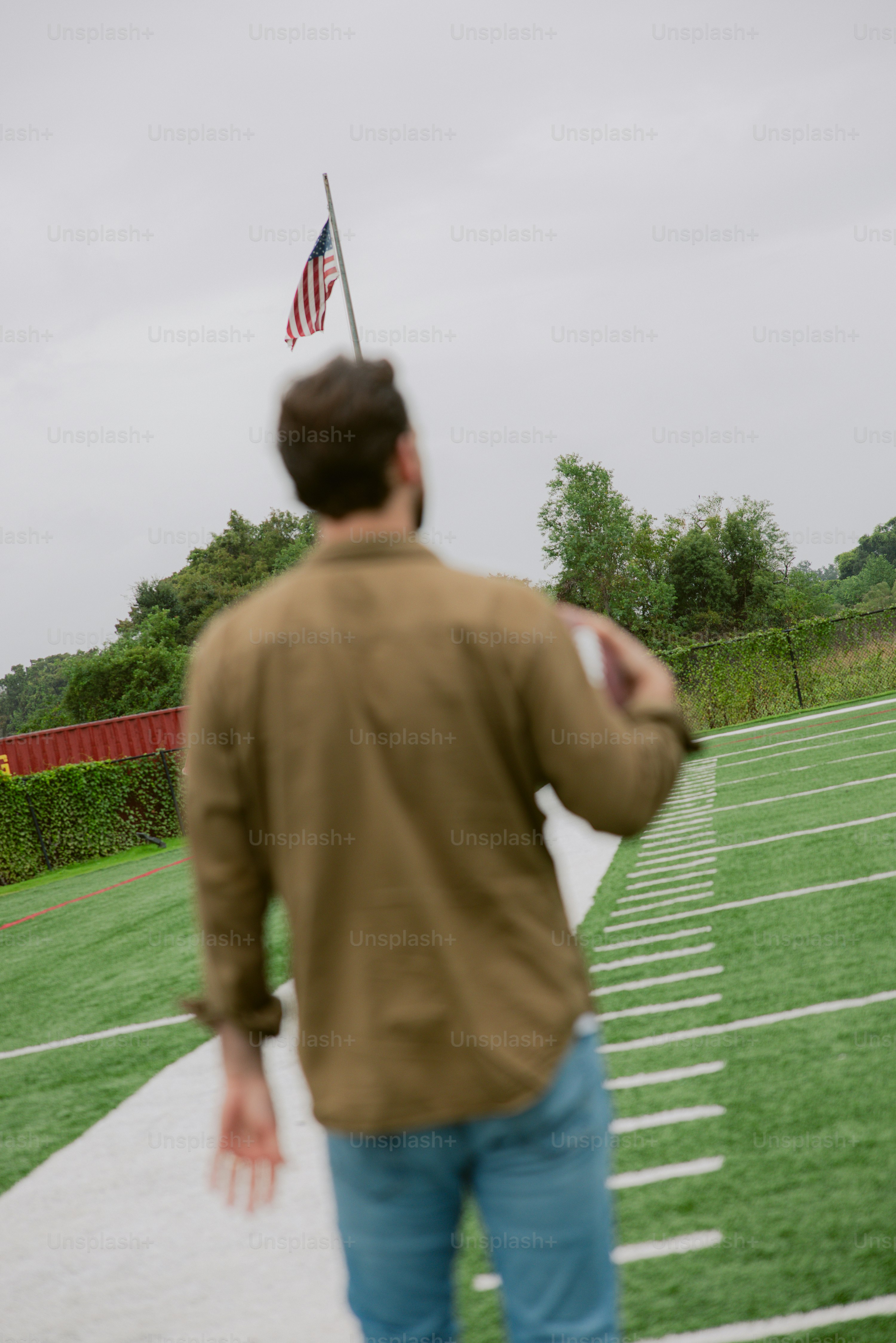 A man is throwing a frisbee on a field