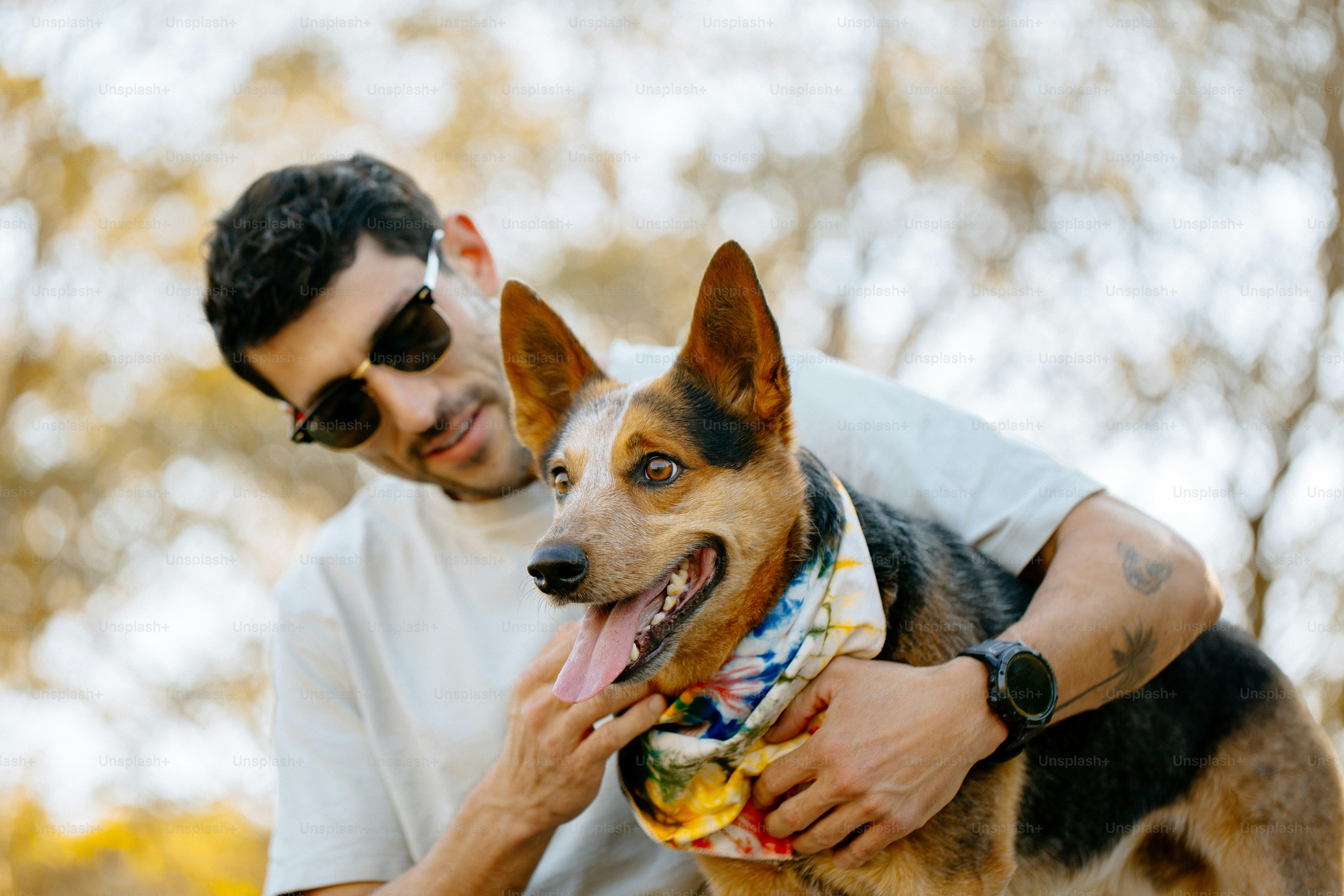 A man holding a dog in his arms