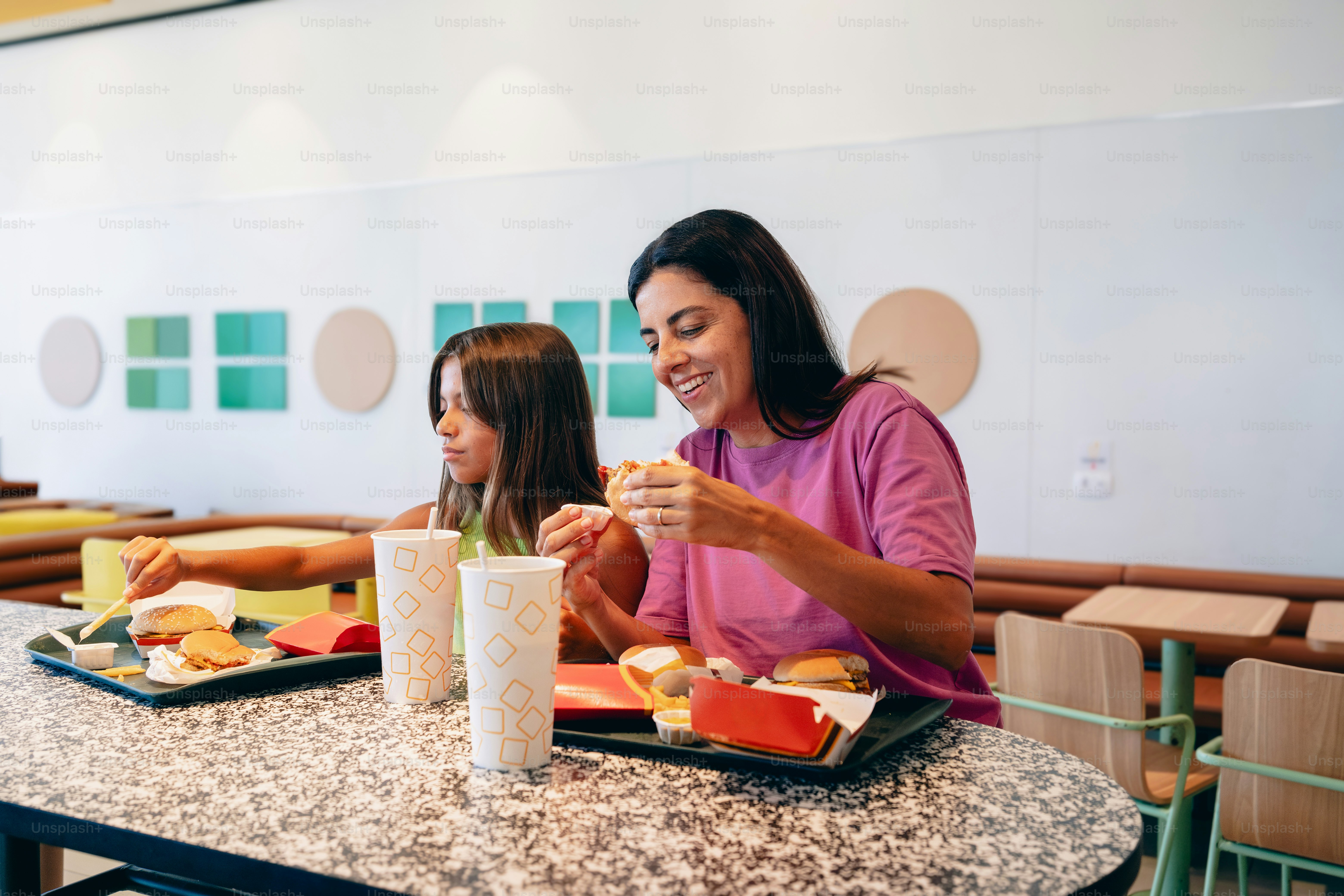 A group of people sitting at a table eating food