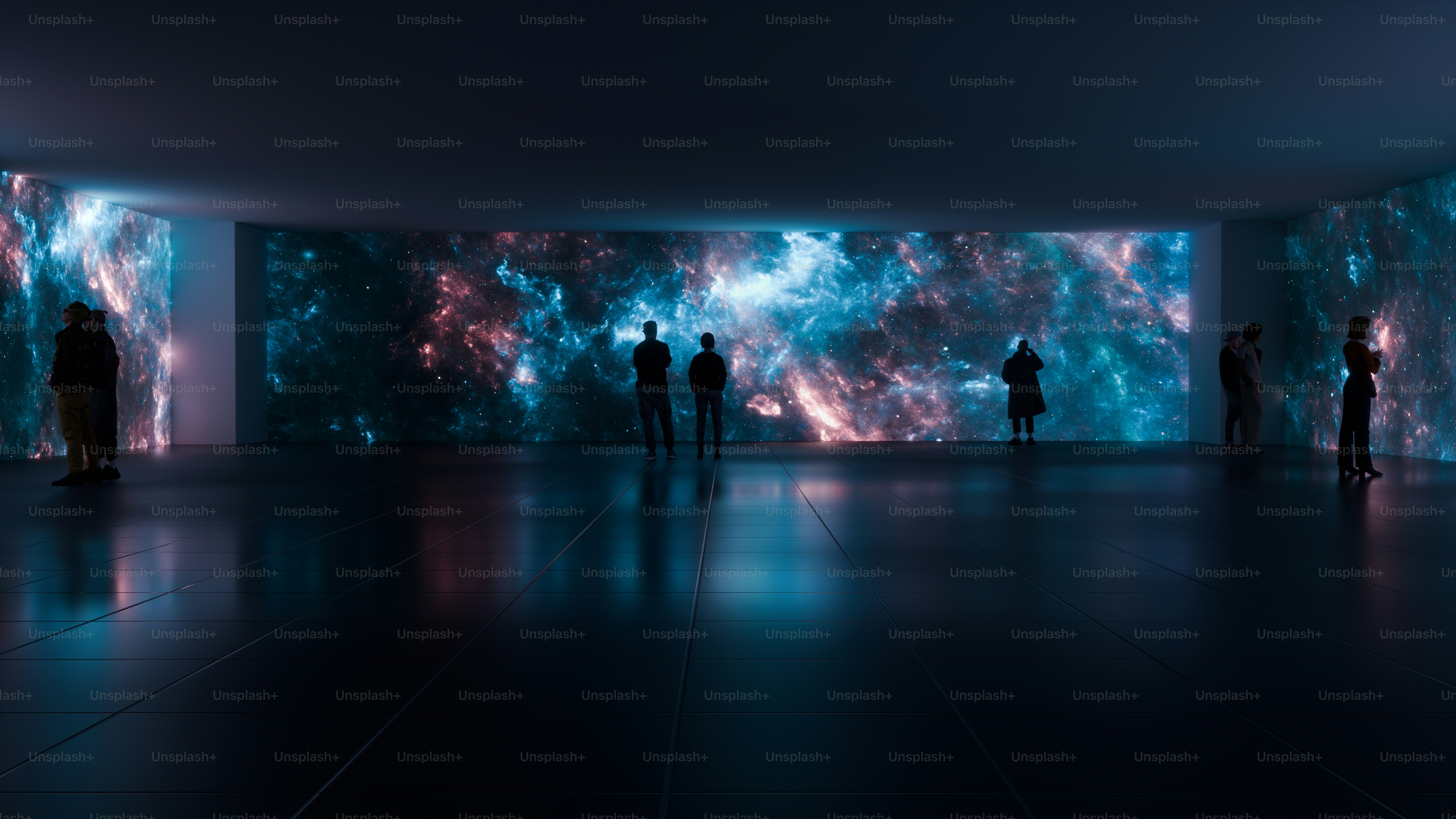 A group of people standing in a dark room