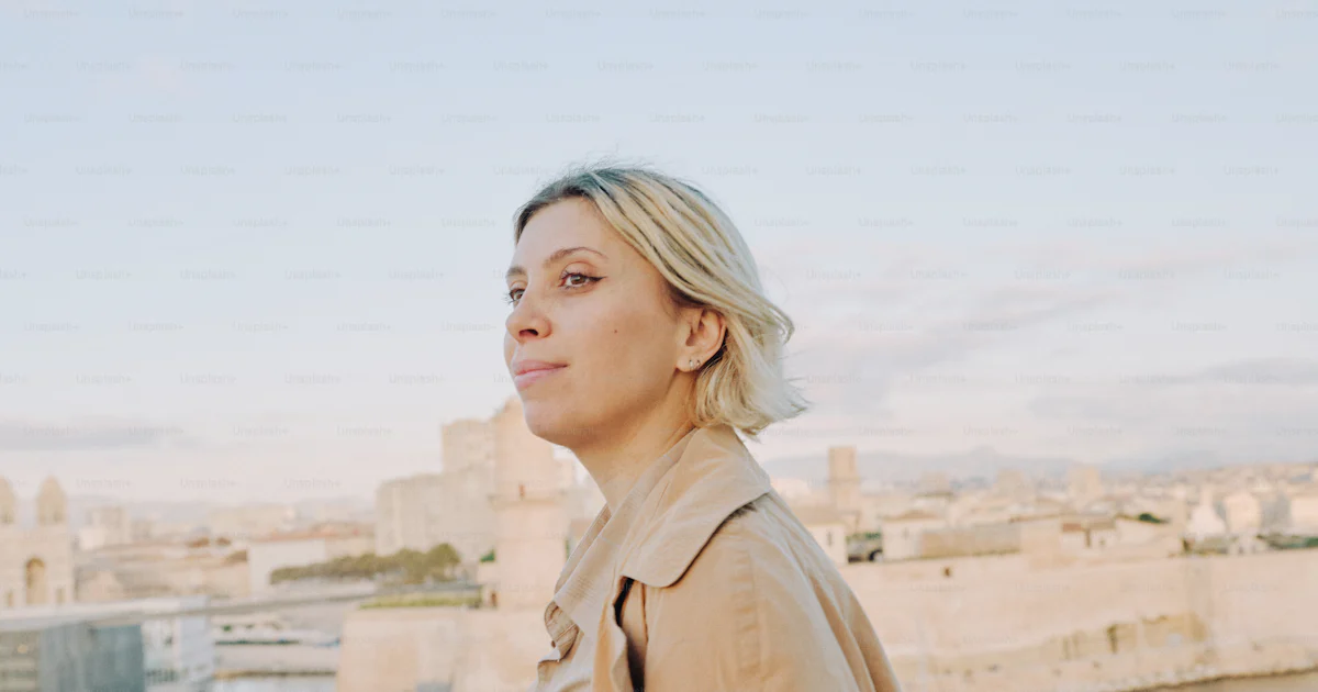 Woman gazes at a city from an elevated viewpoint. photo – Portrait ...