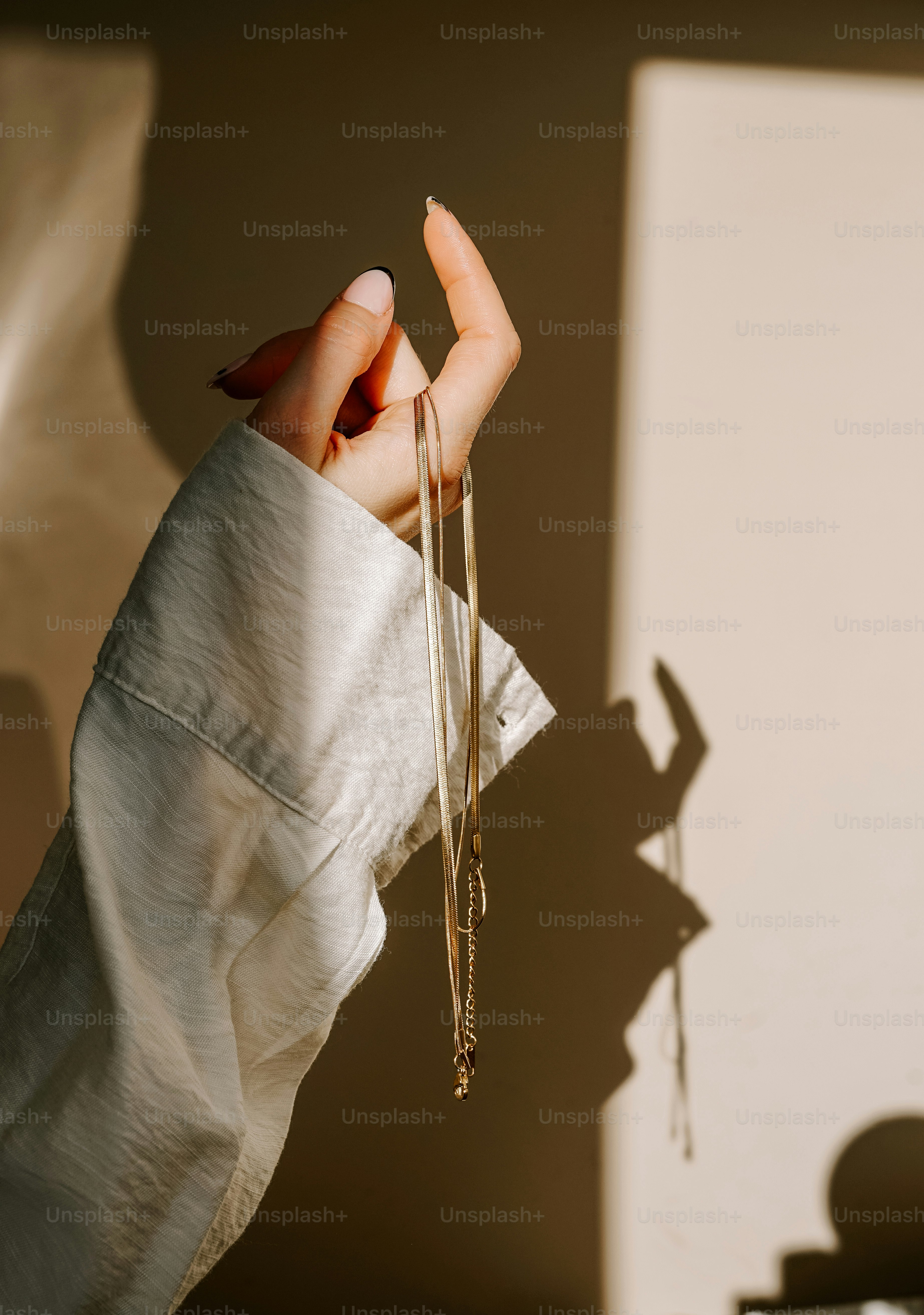 A person holding a pair of scissors in their hand