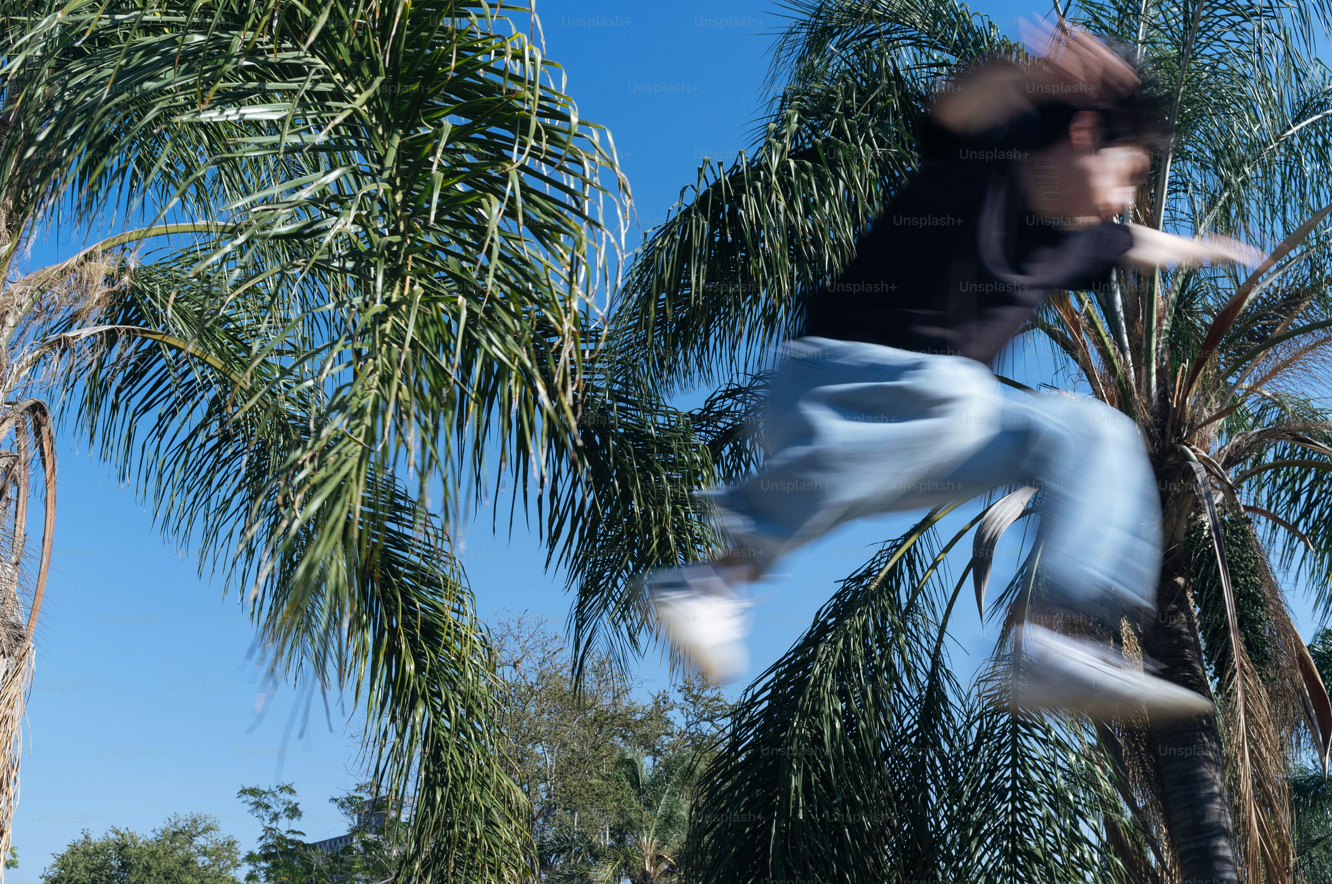 A man flying through the air while riding a skateboard