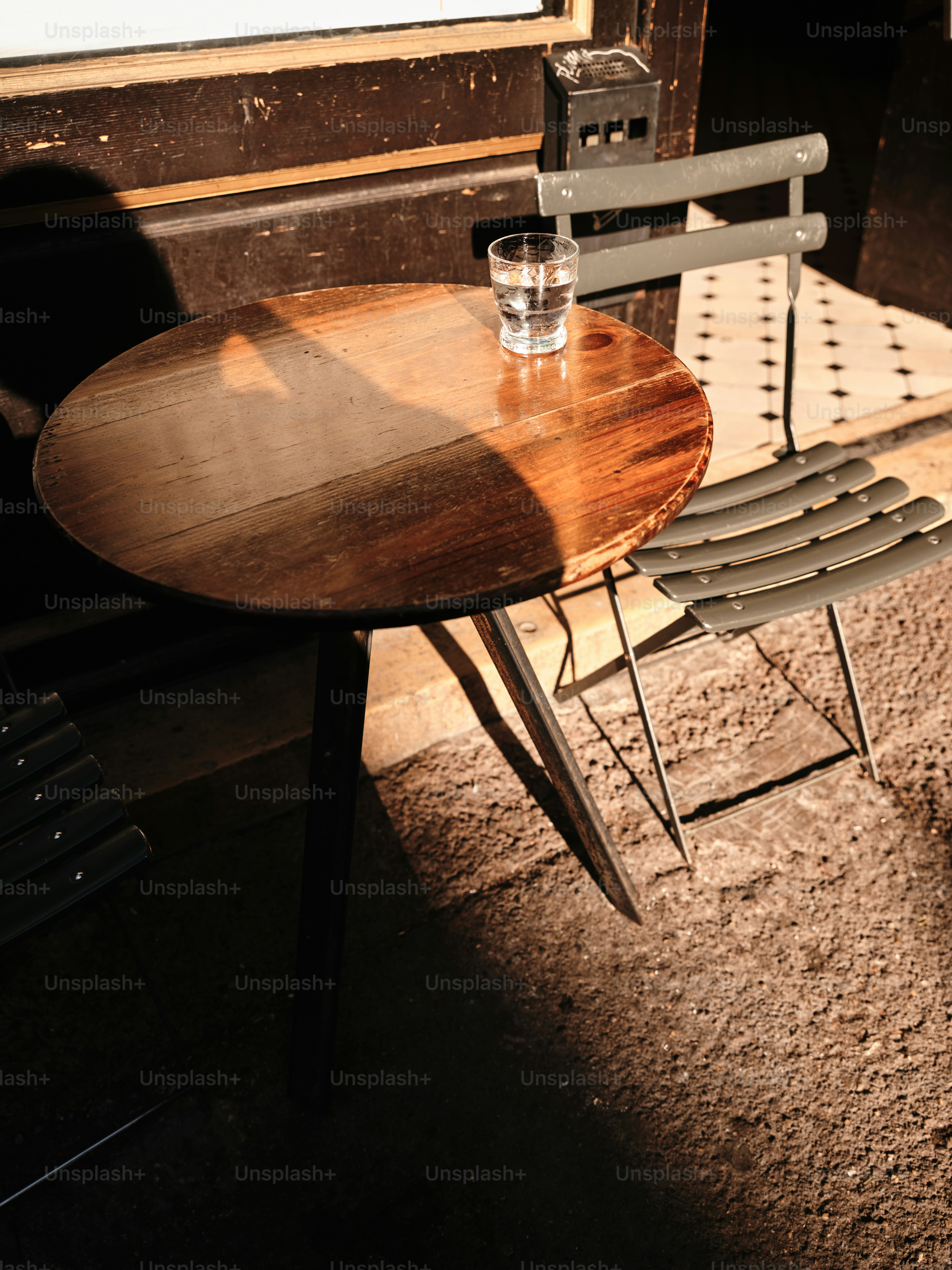 A chair and table in front of a window