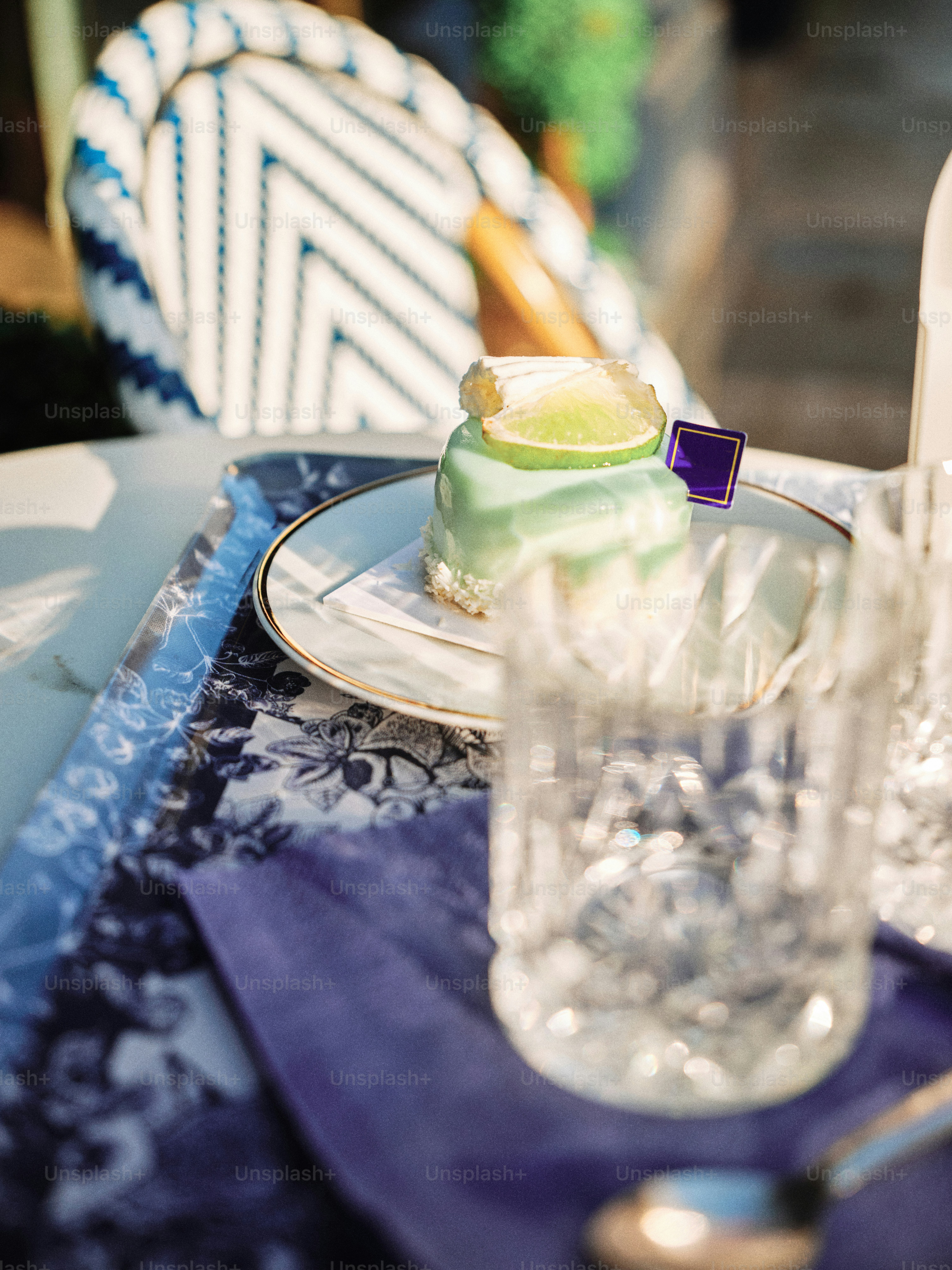 A plate with a cake on it sitting on a table