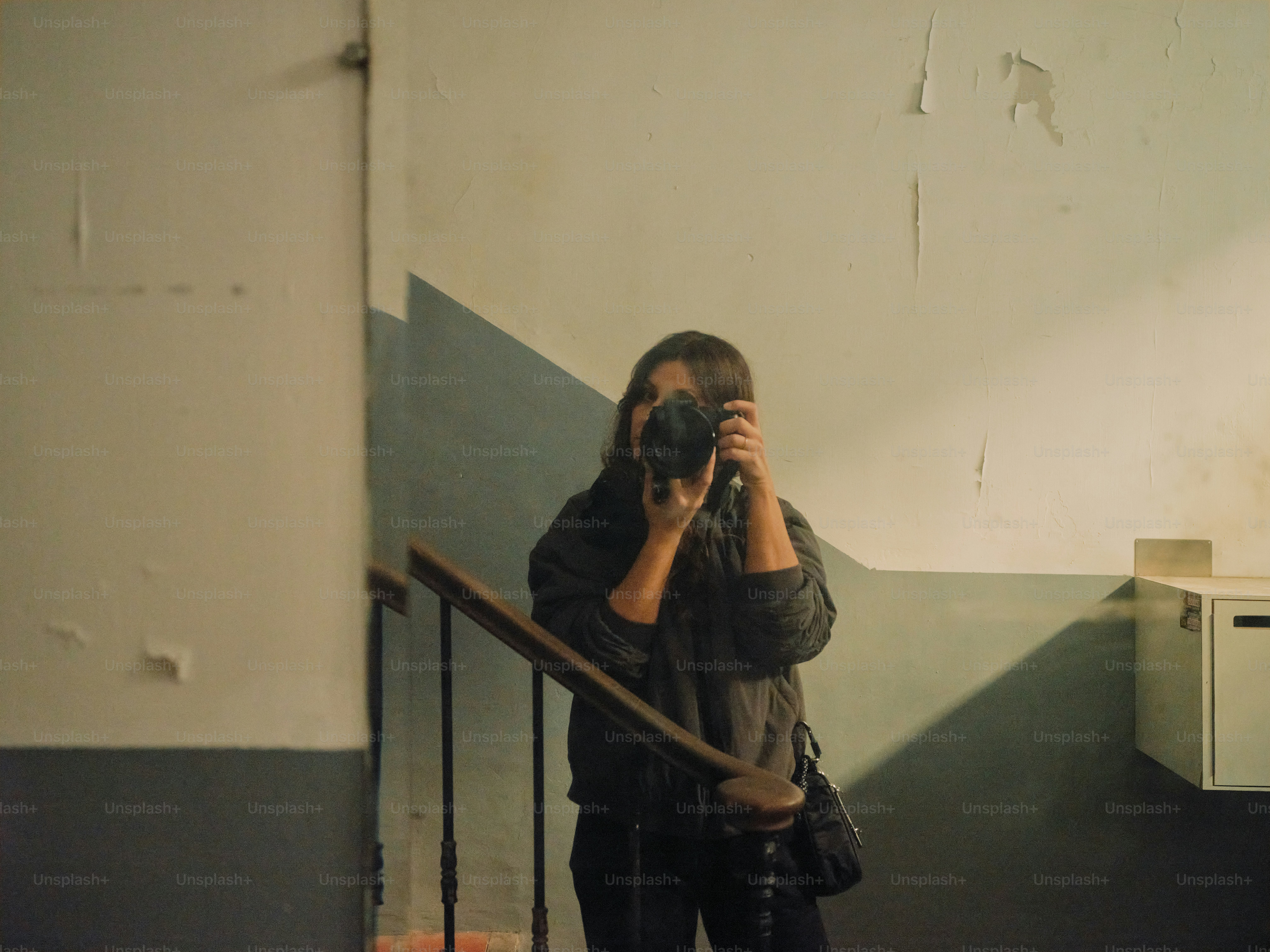 A woman taking a picture of herself in a mirror