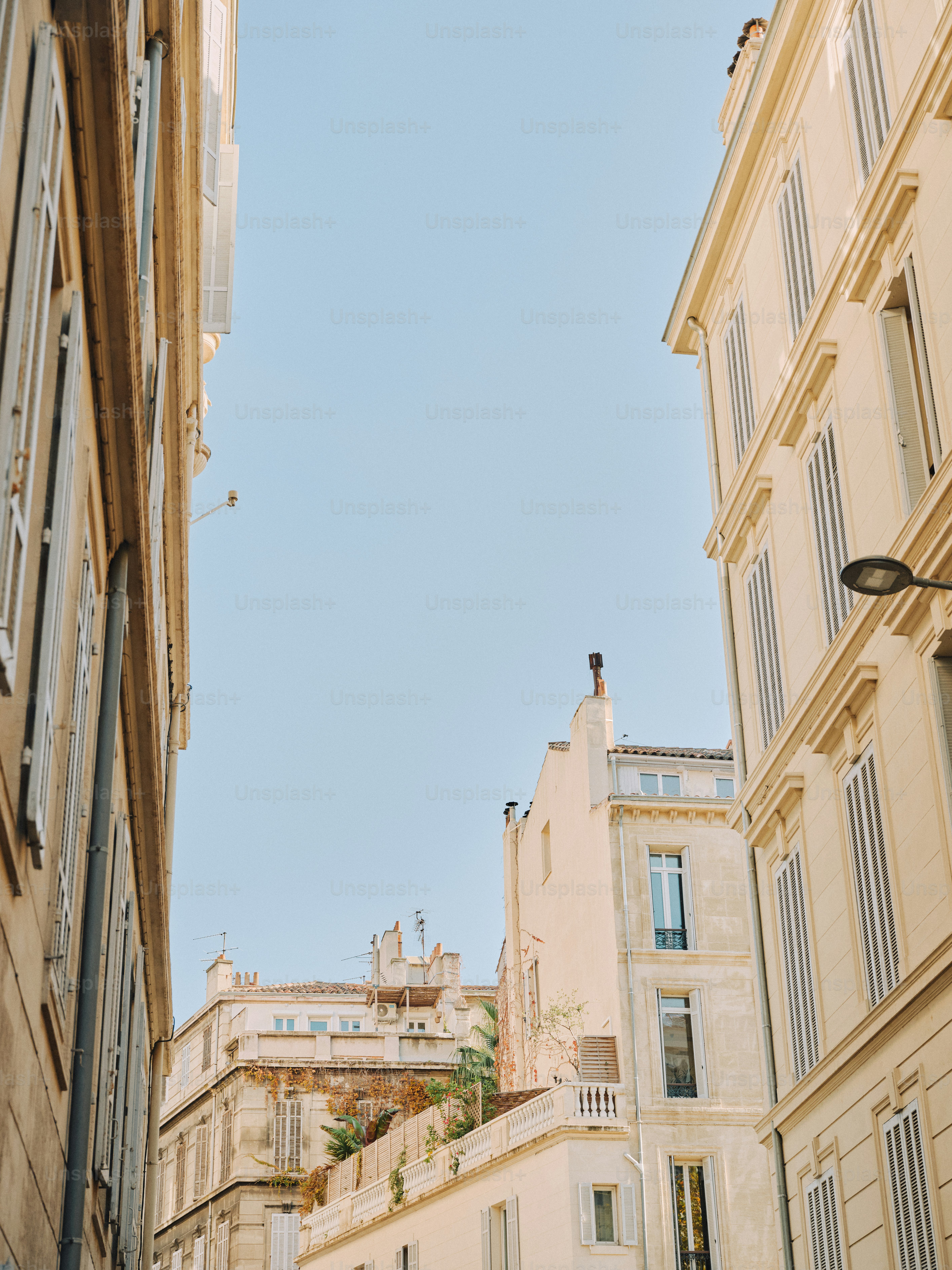 A narrow city street lined with tall buildings