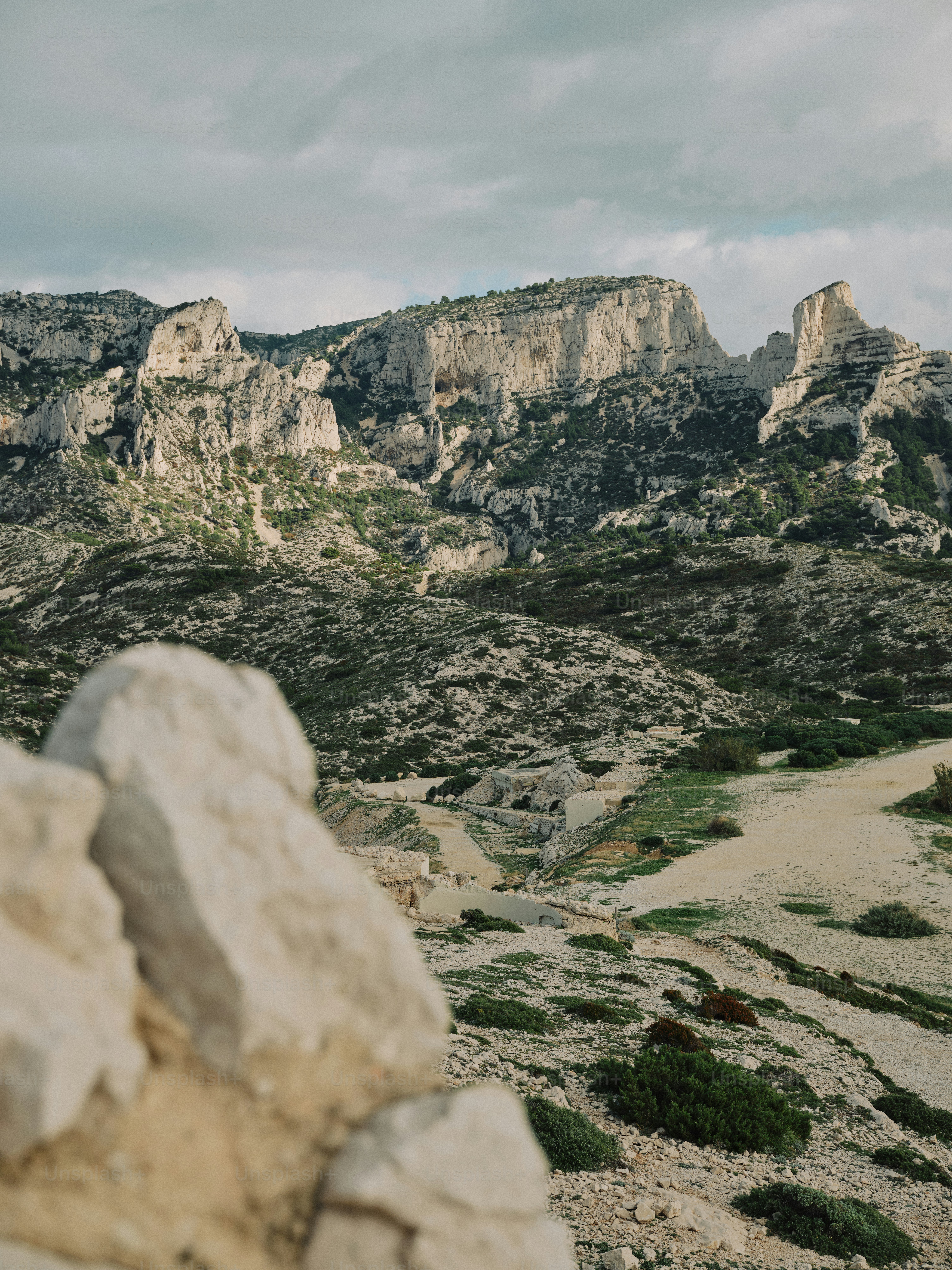 A rocky landscape with a few rocks in the foreground