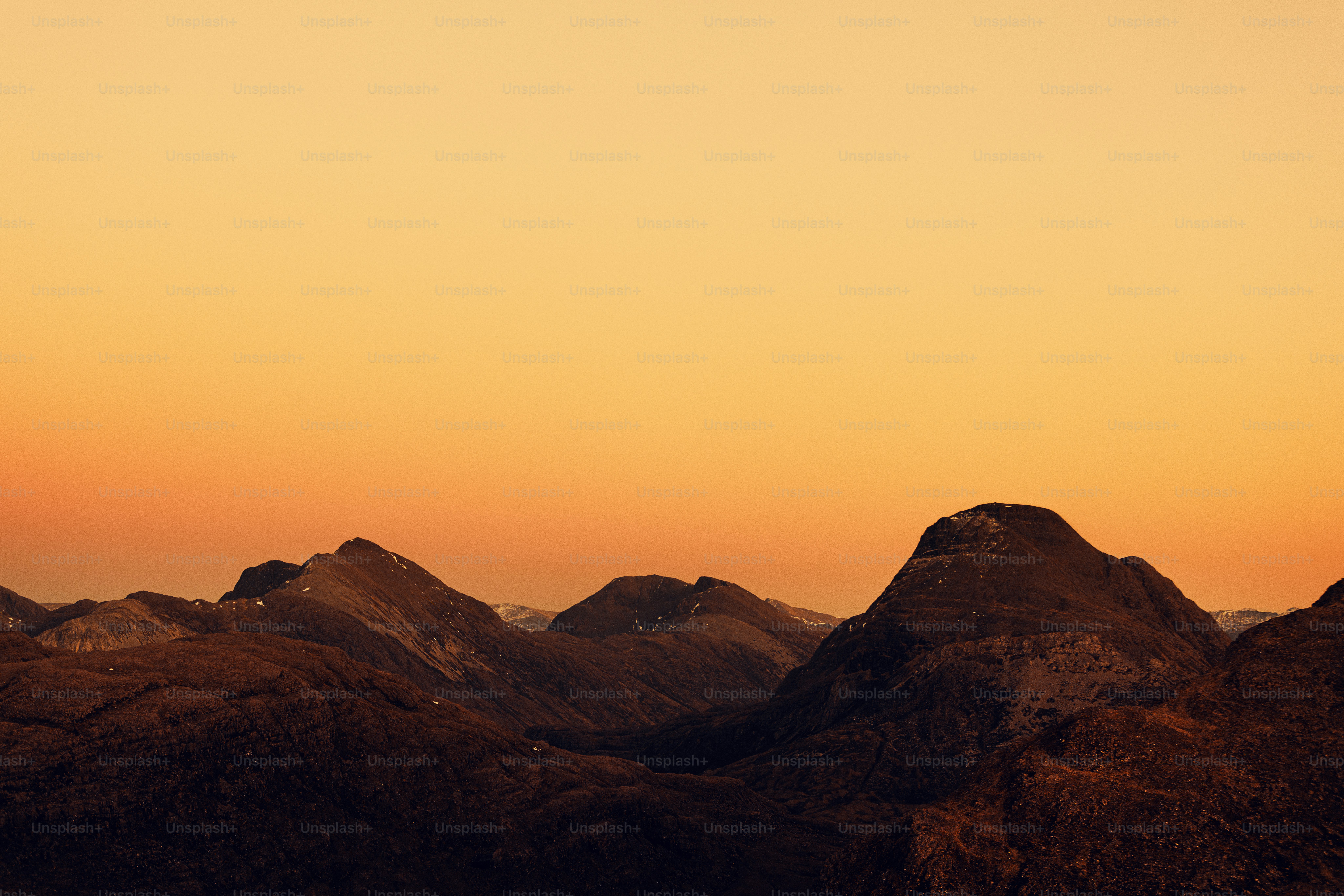 A view of a mountain range at sunset