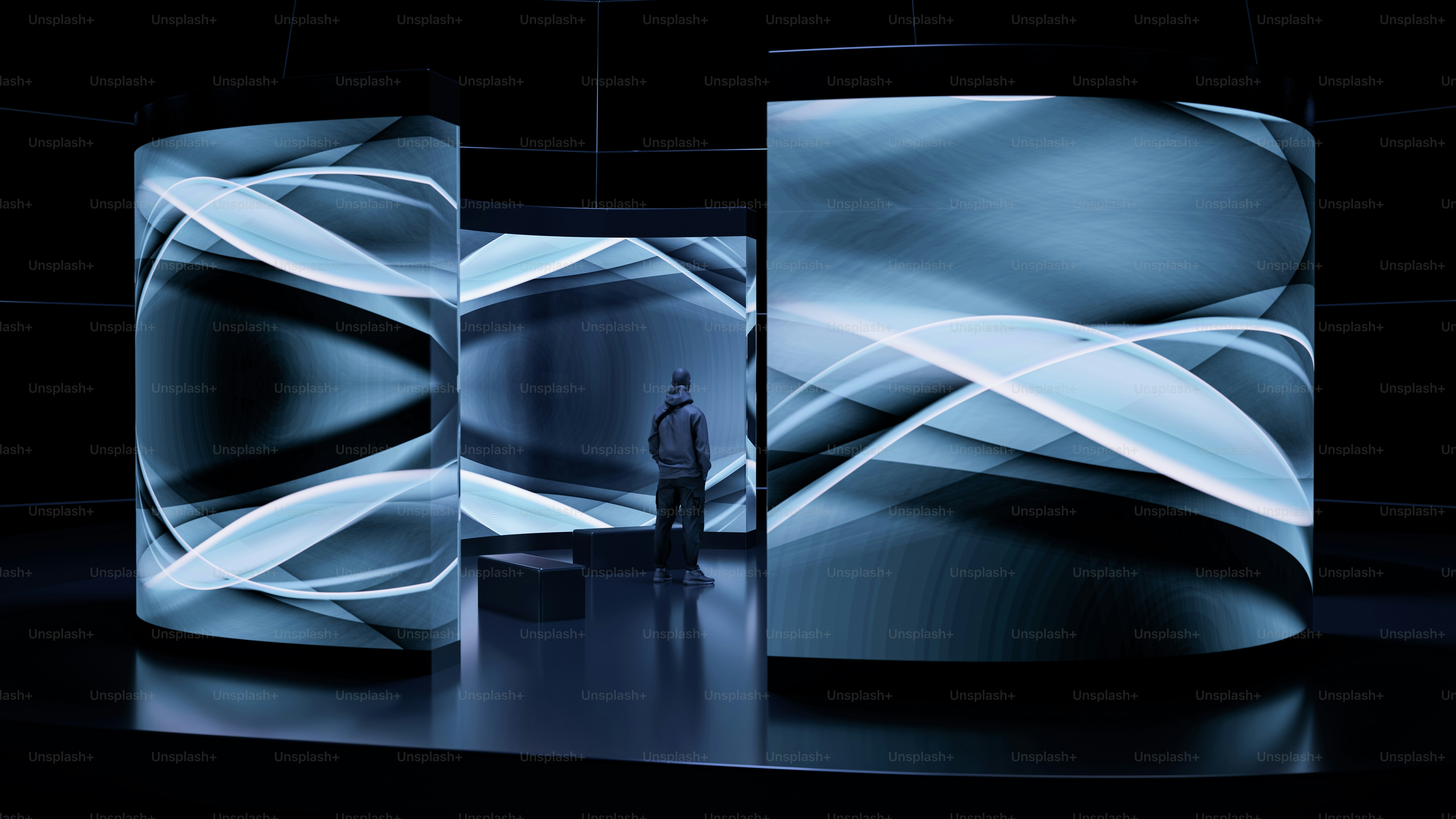 A man standing in front of a large screen