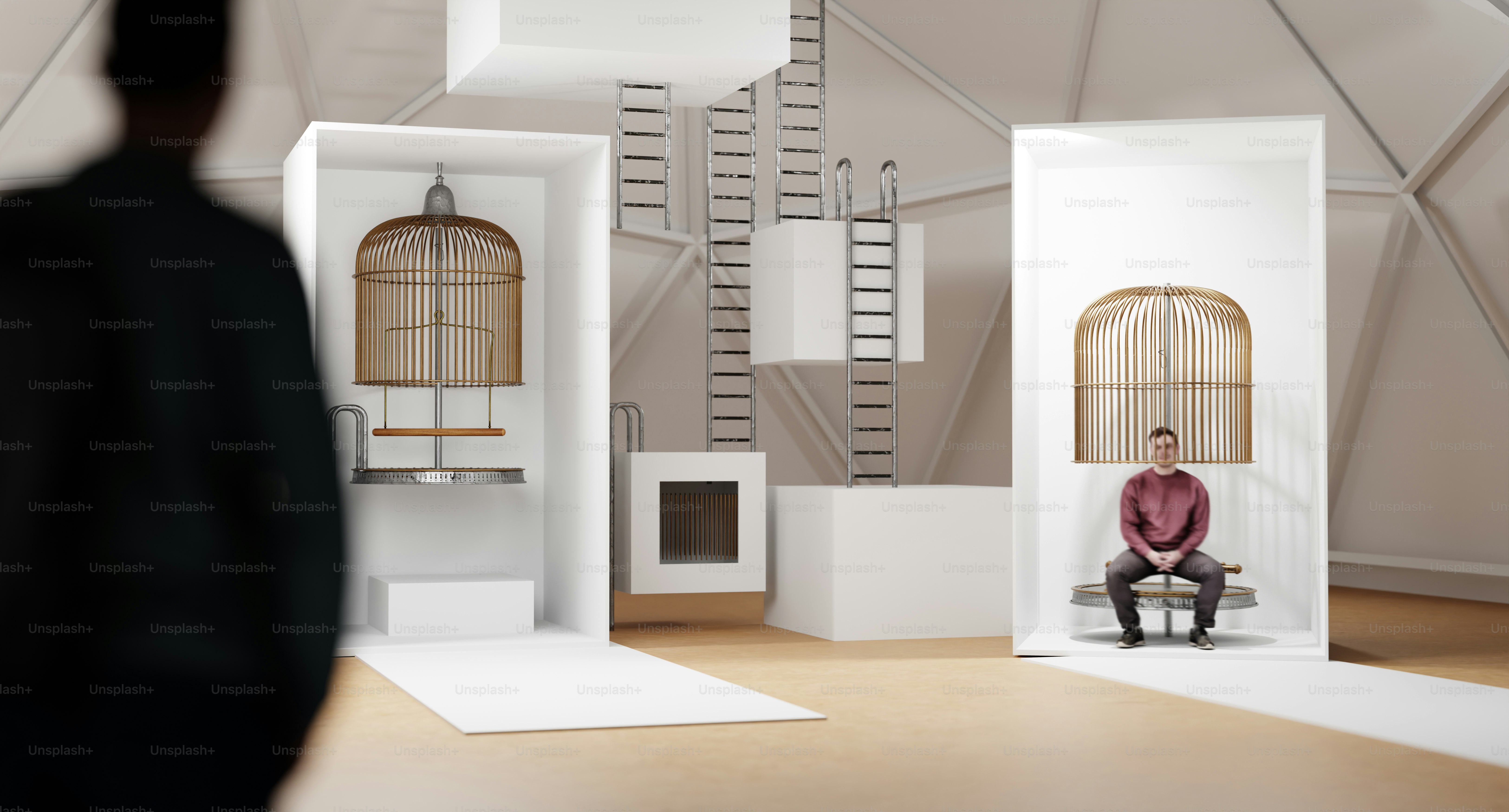 A man sitting on a chair in front of a white room