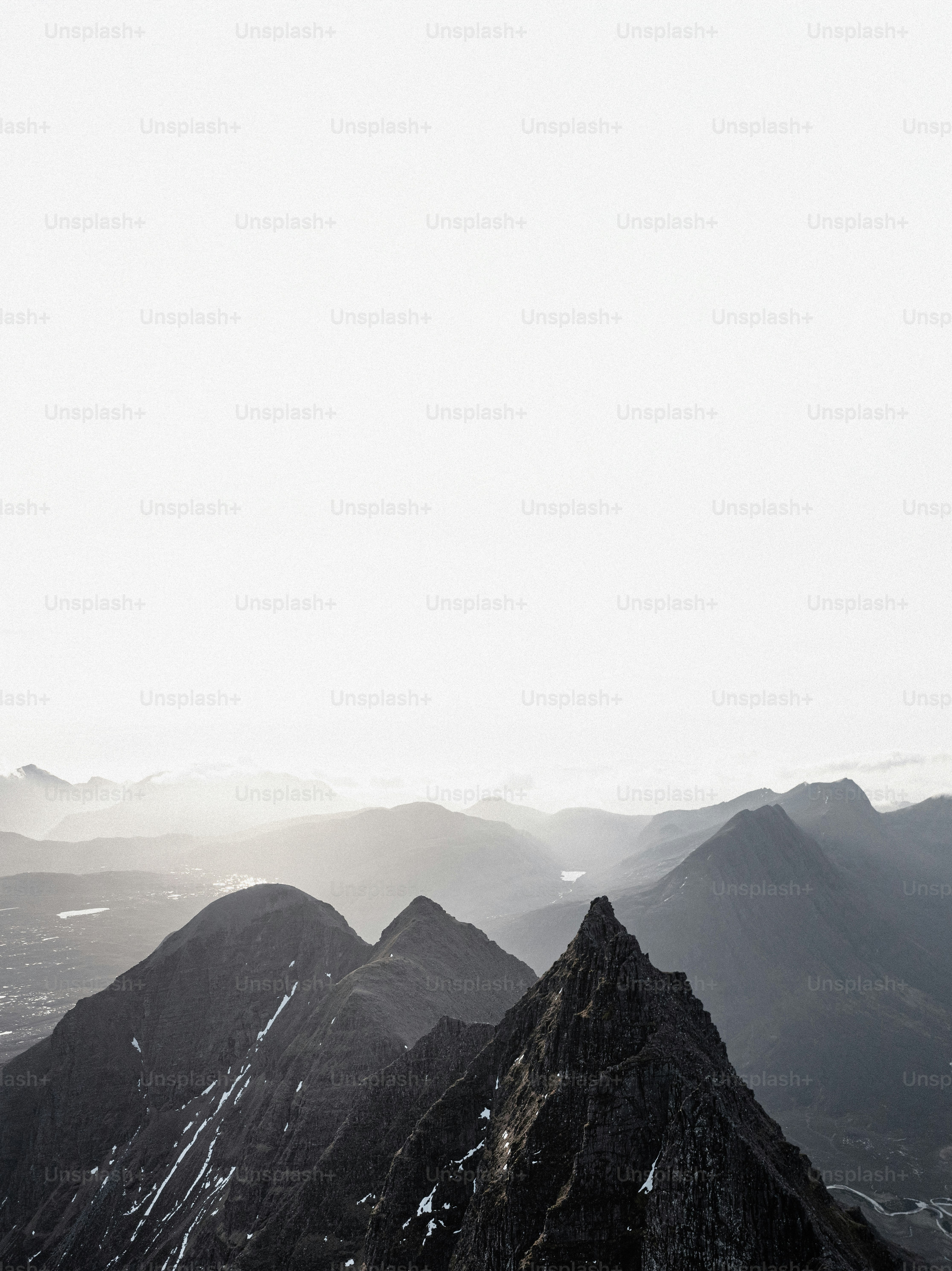 A man standing on top of a snow covered mountain