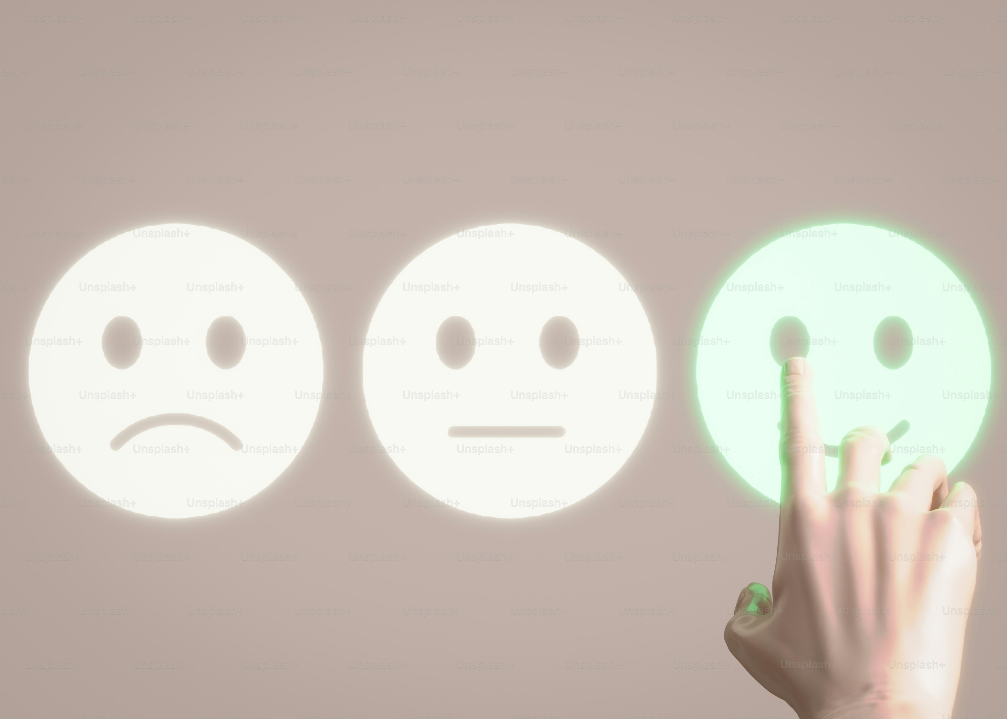 A hand is pointing at three smiley faces