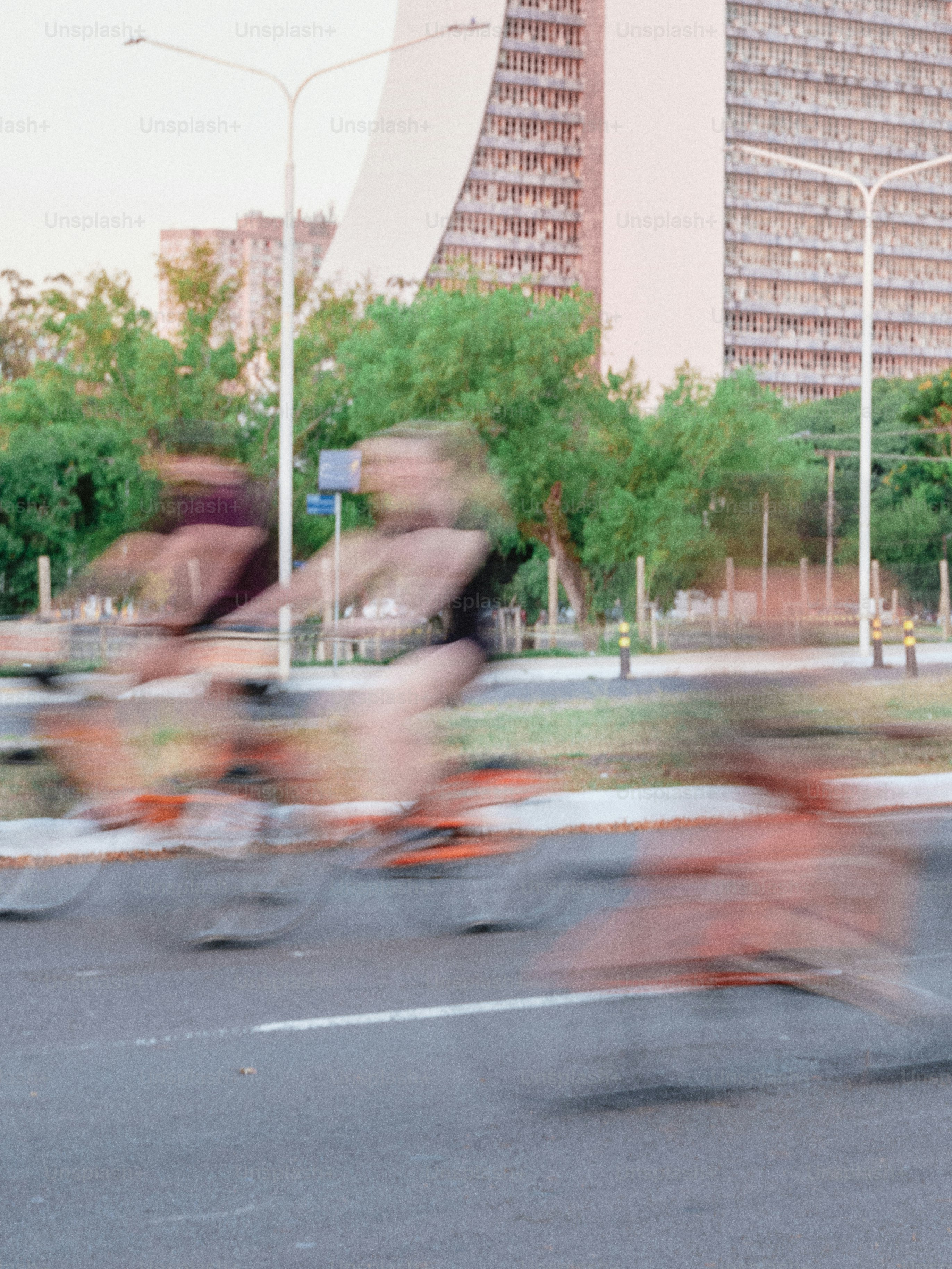 A blurry photo of a group of people riding bikes