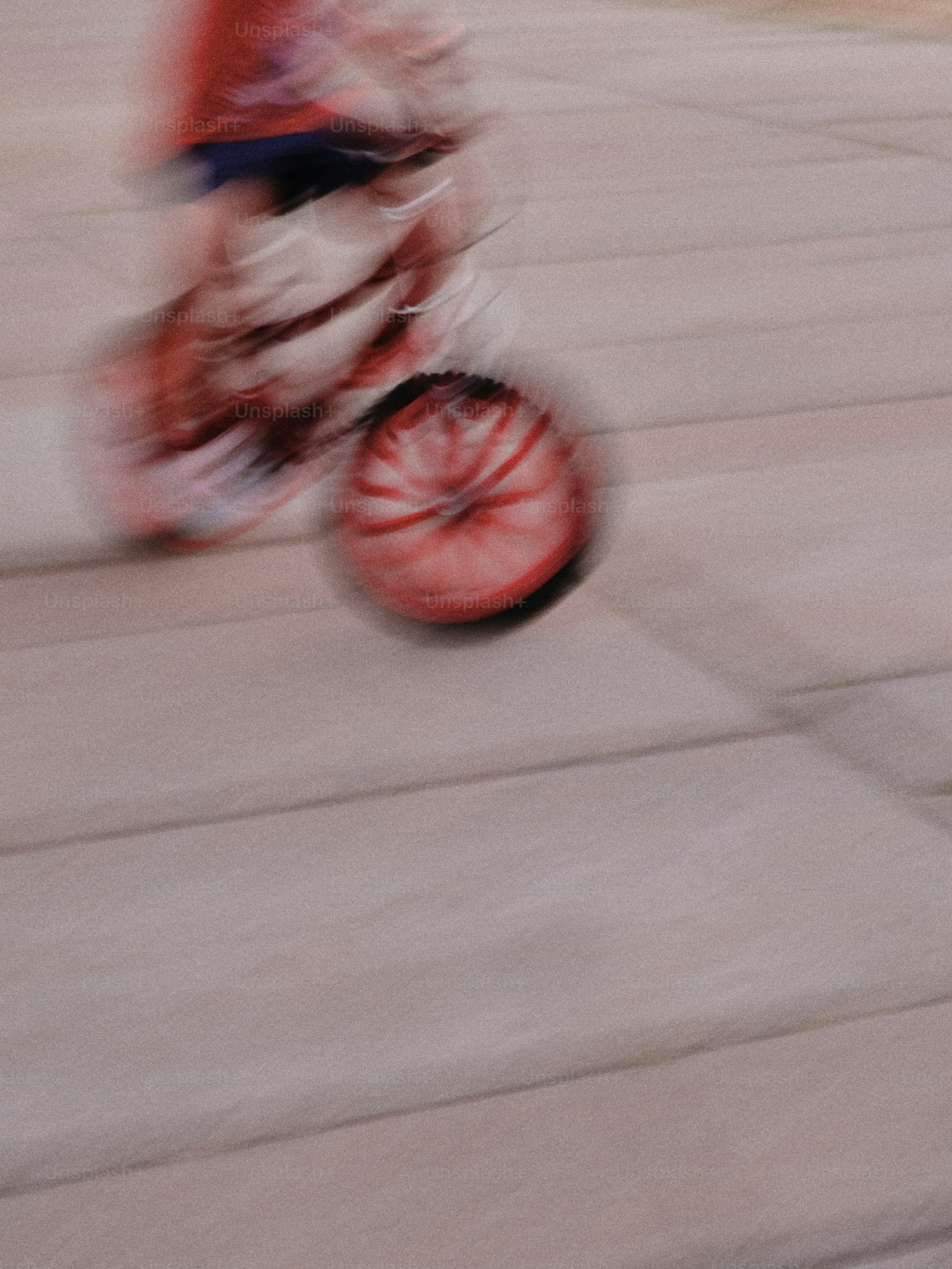 A blurry photo of a person riding a bike