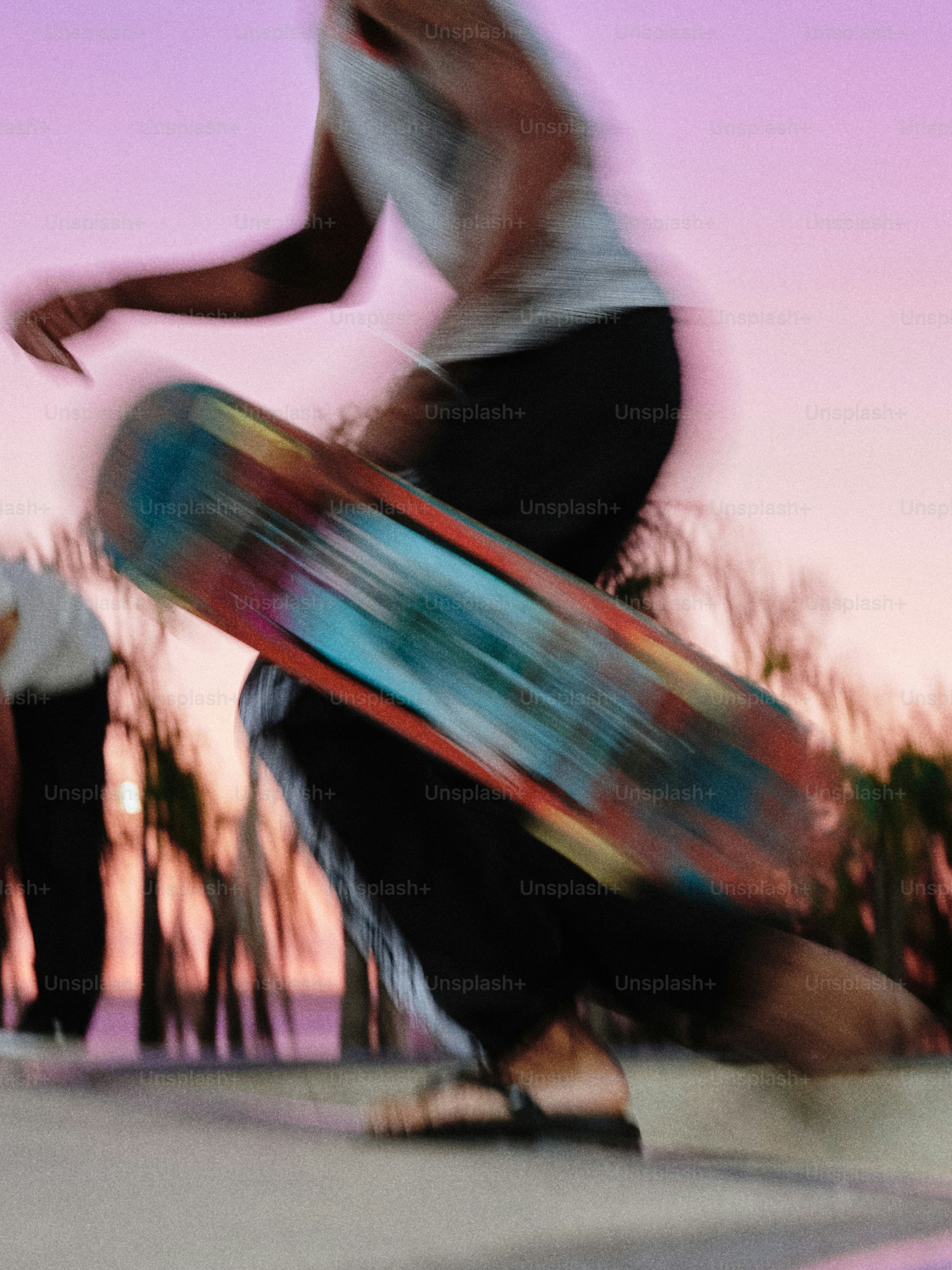 A man riding a skateboard down the side of a ramp