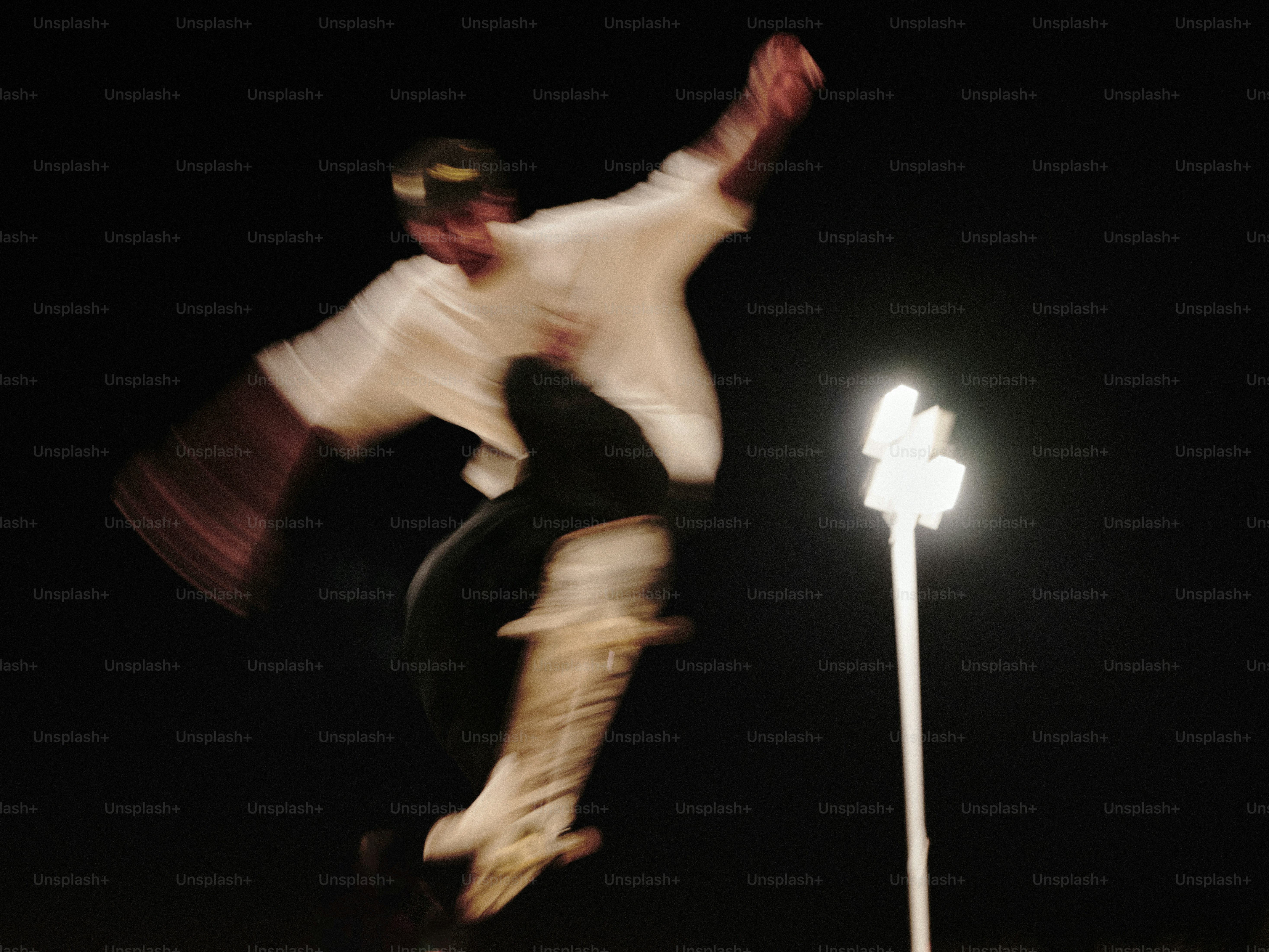 A skateboarder is doing a trick in the air