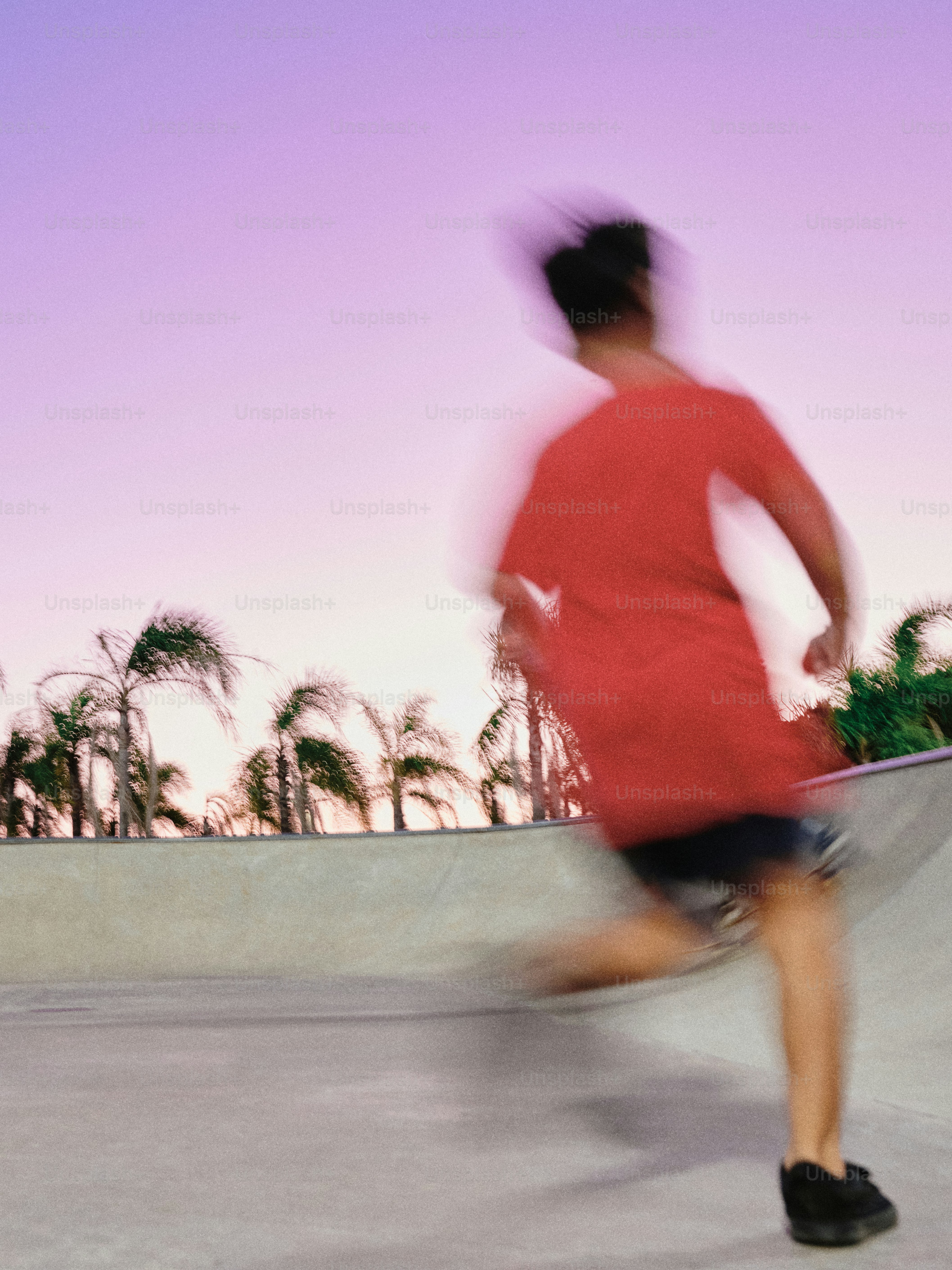 A man riding a skateboard up the side of a ramp