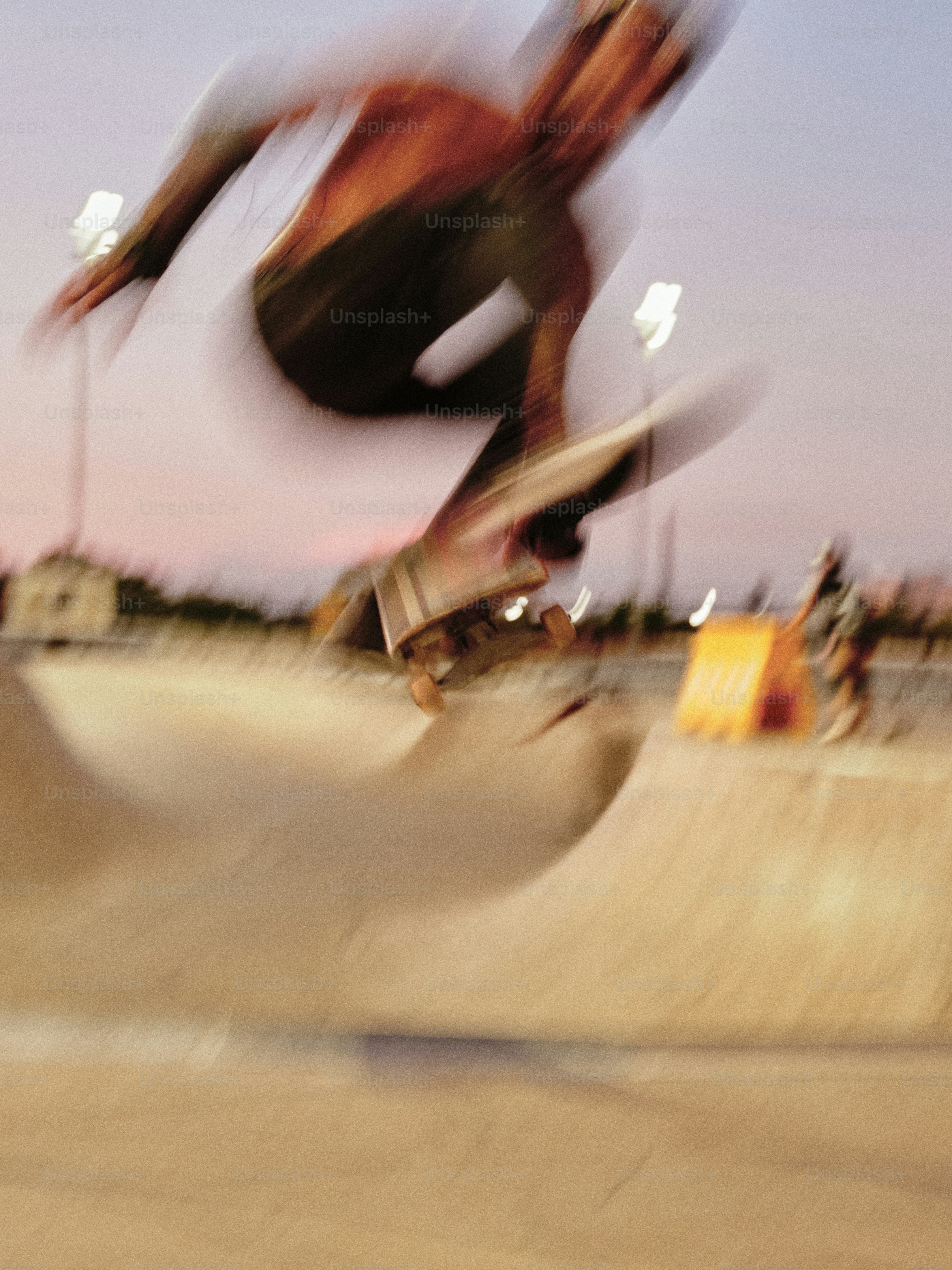 A man riding a skateboard up the side of a ramp