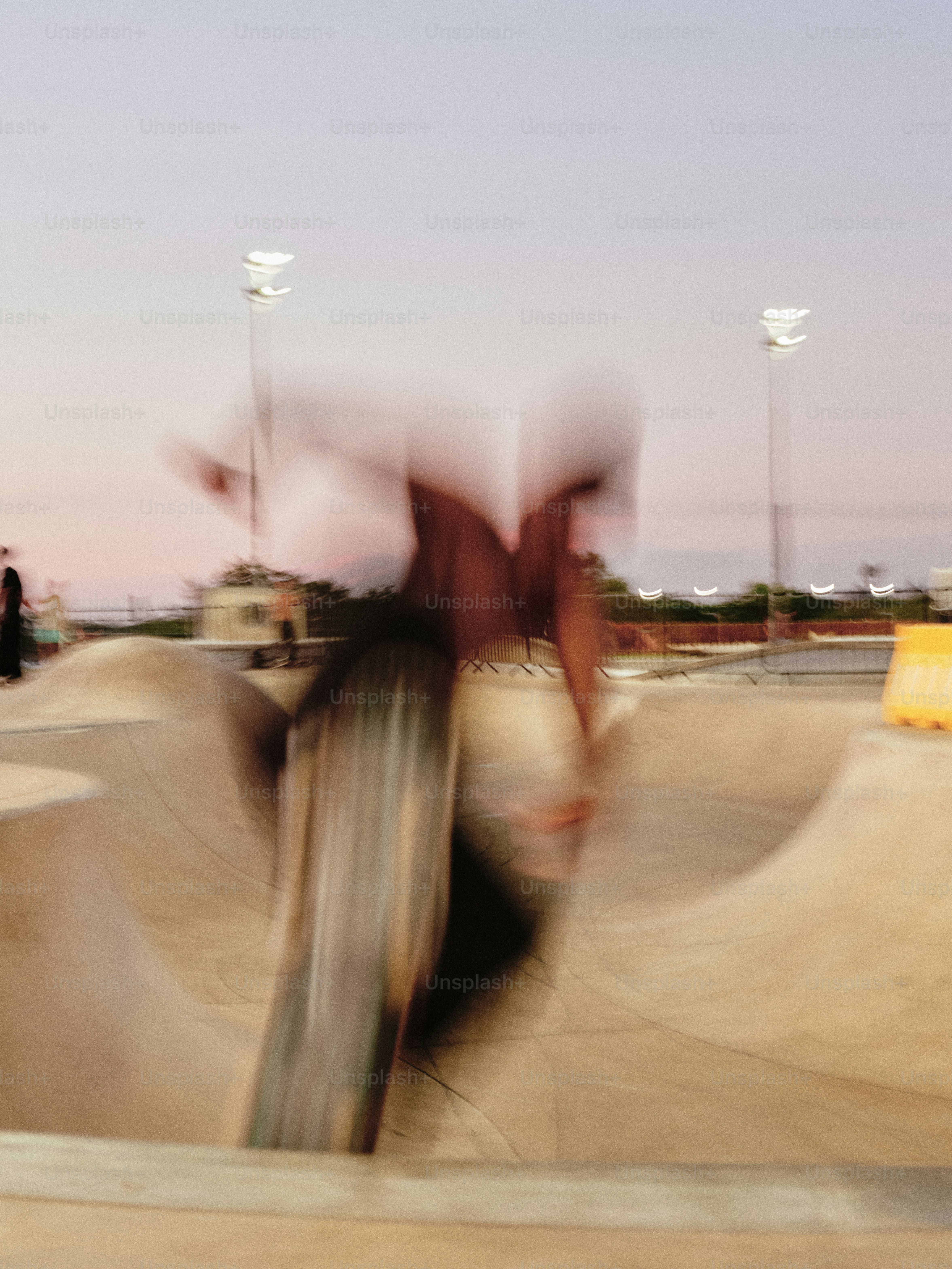 A blurry photo of a person on a skateboard