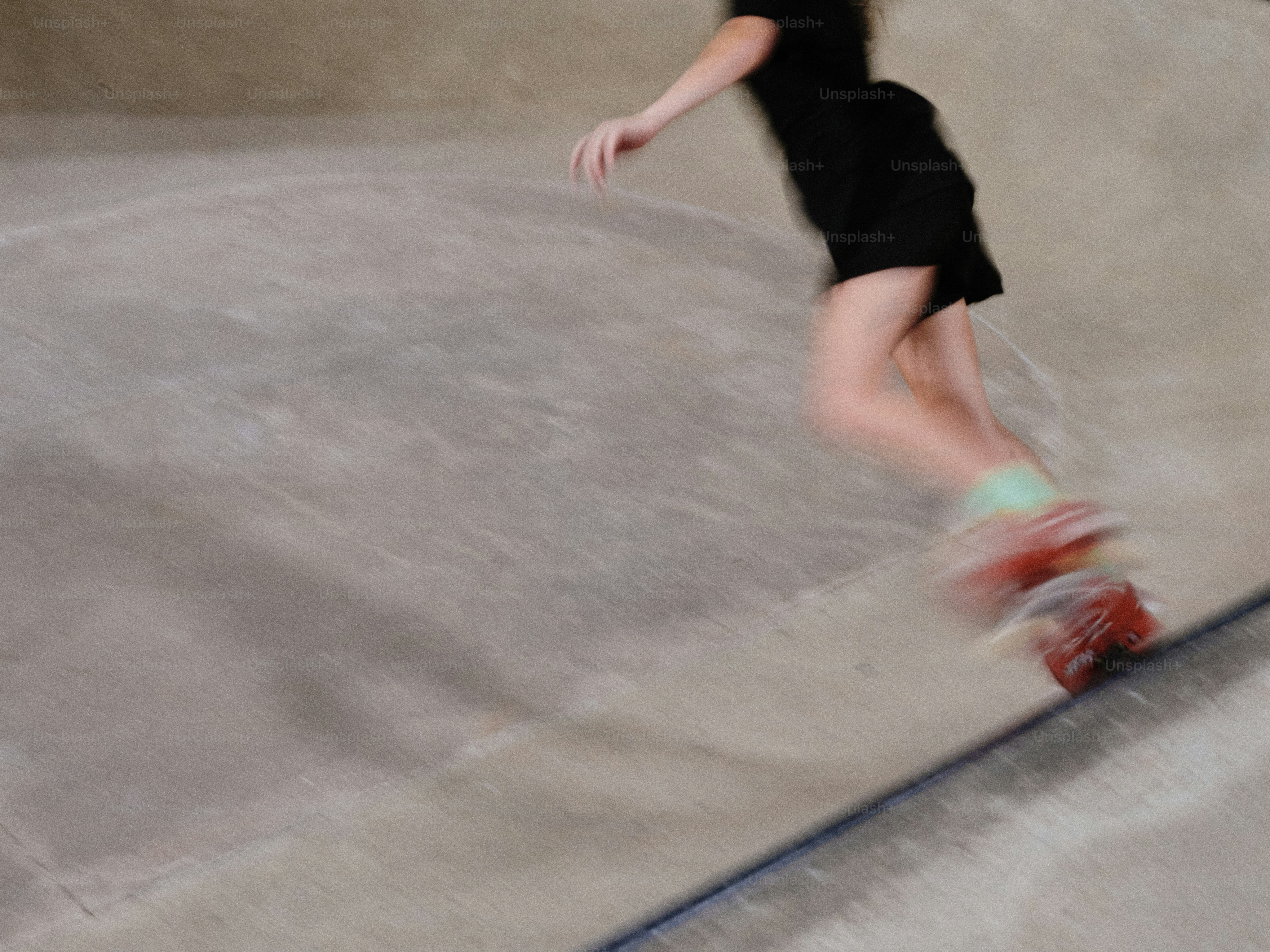 A person riding a skate board on a ramp