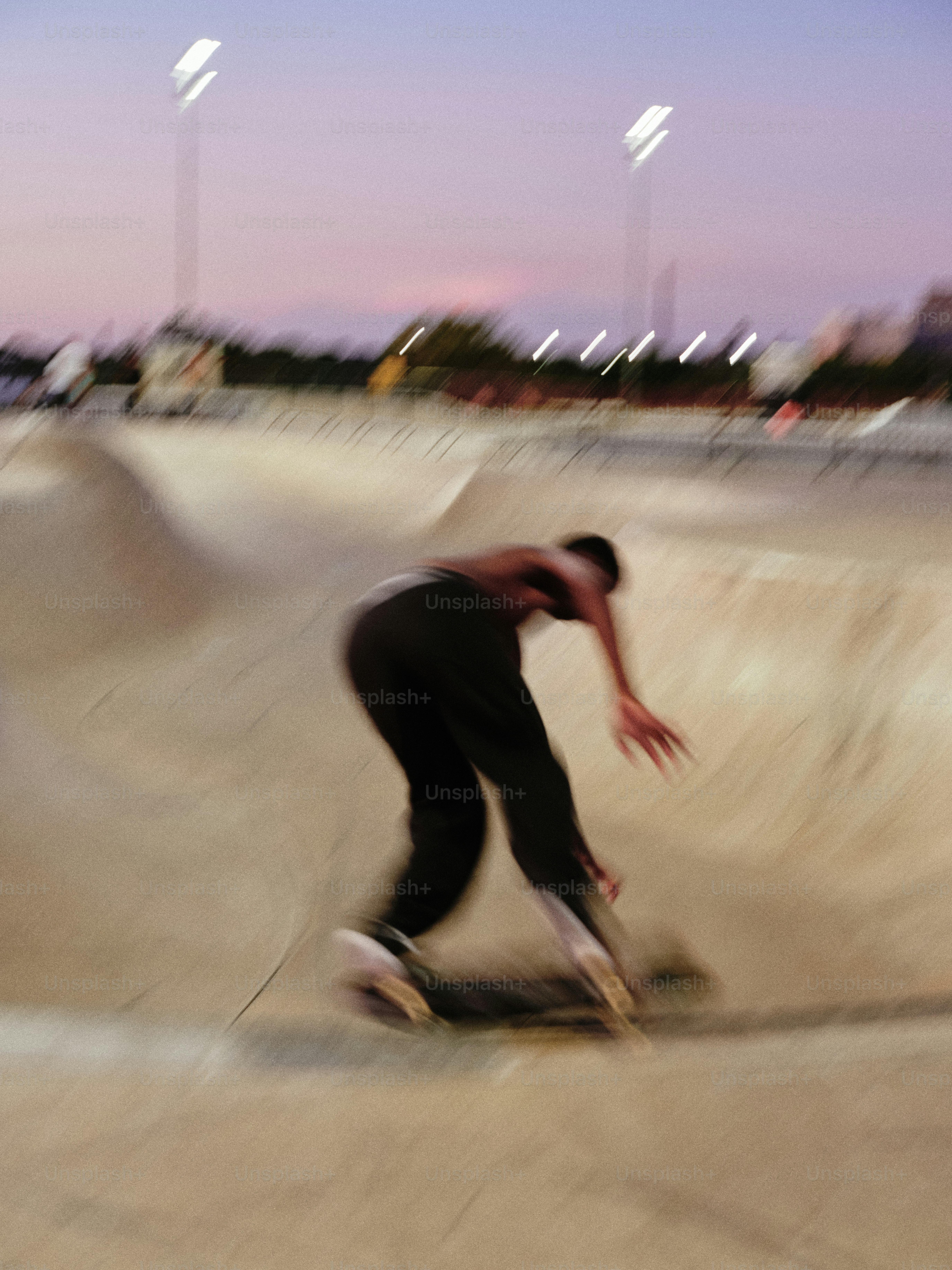 A man riding a skateboard up the side of a ramp