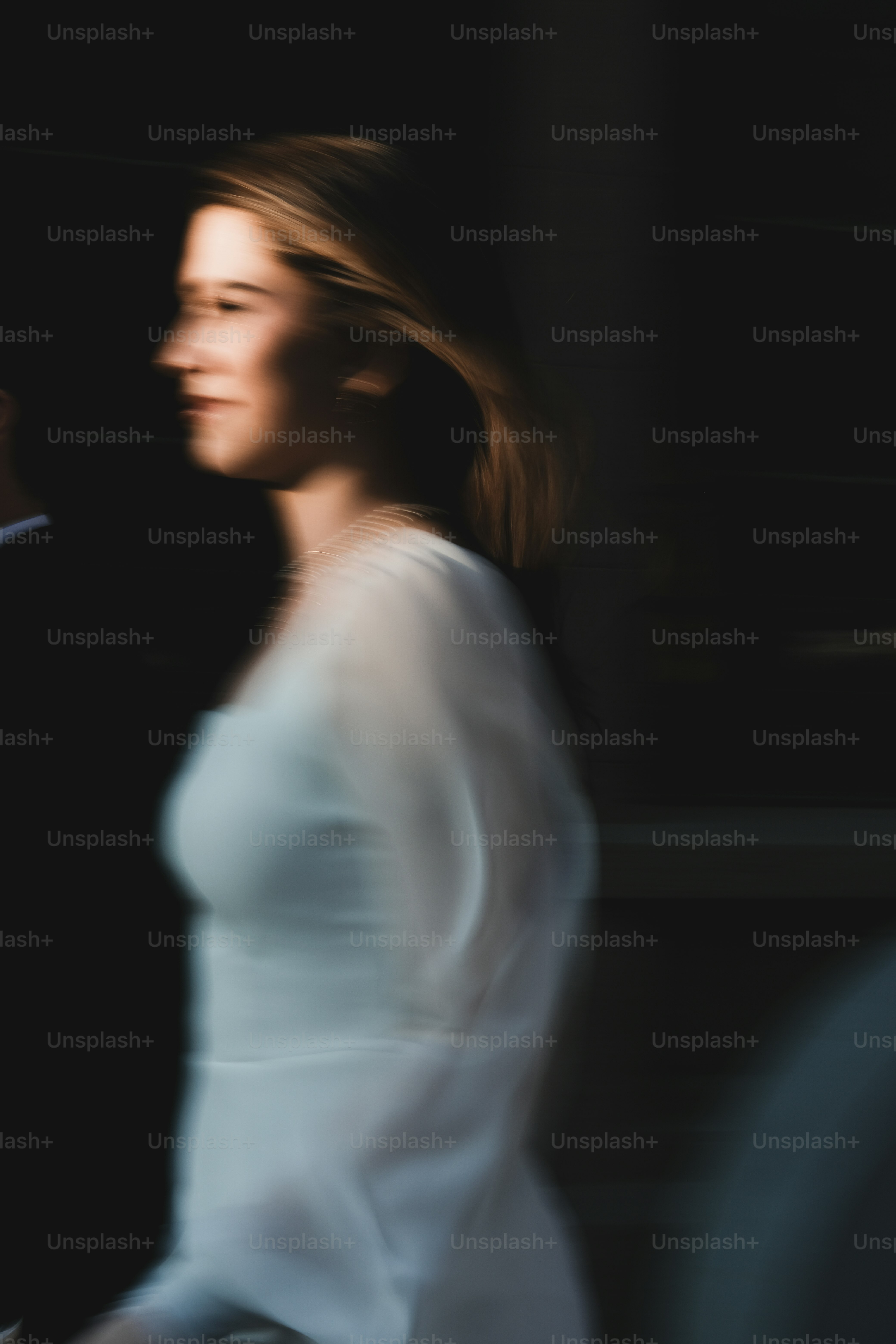 A man and a woman walking down a street