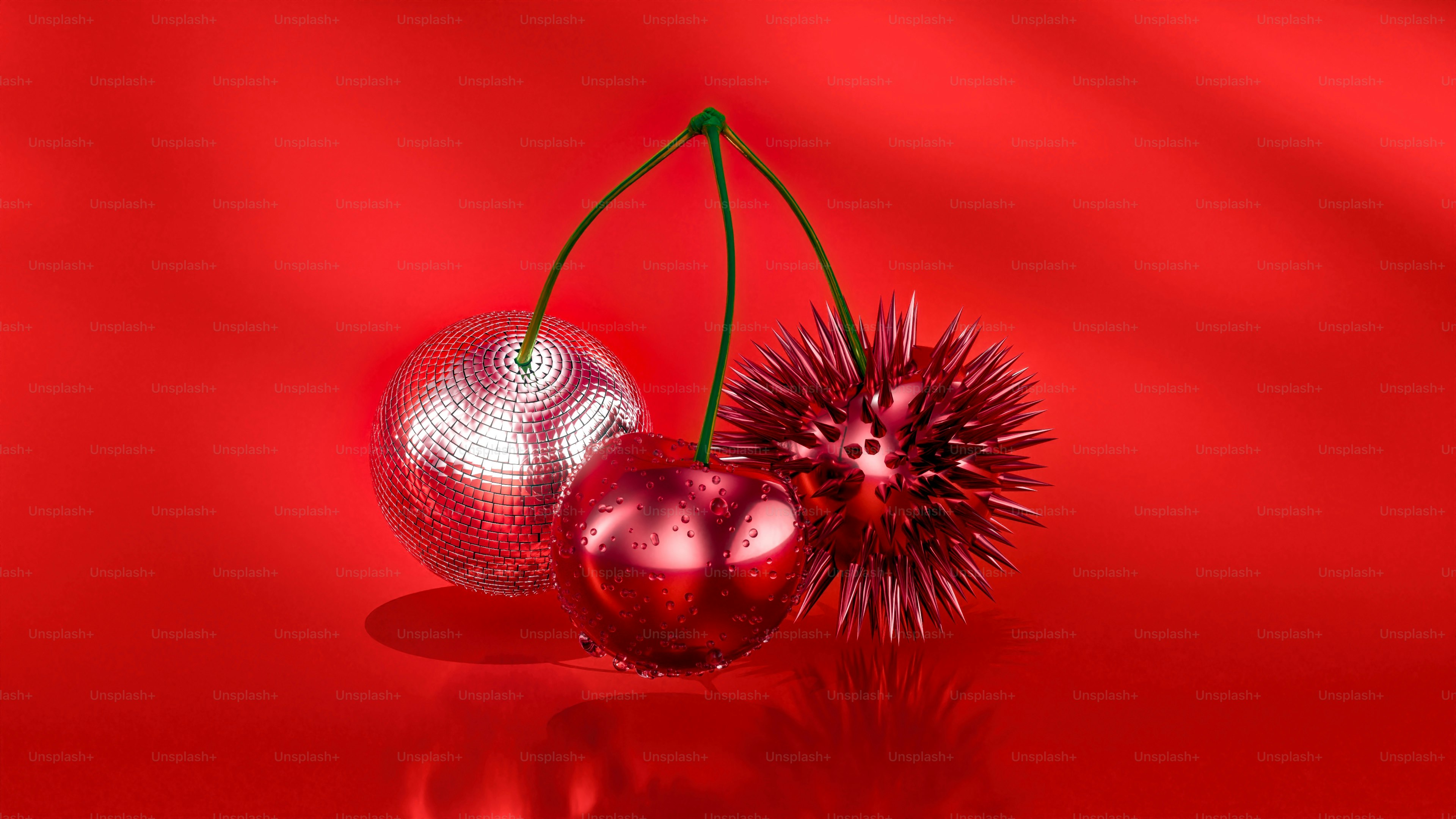 Dos cerezas colocadas sobre una superficie brillante