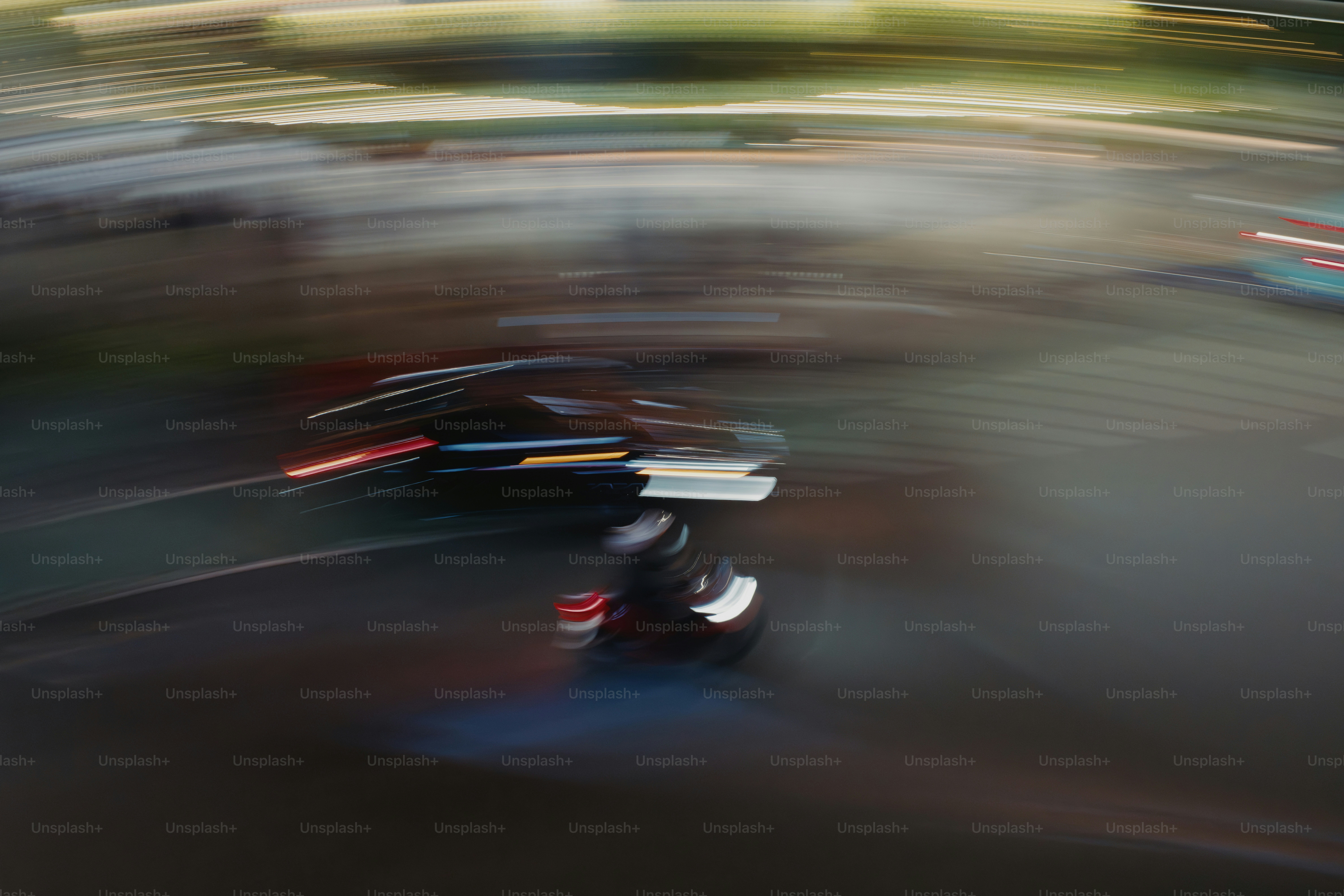 A blurry photo of a person riding a scooter