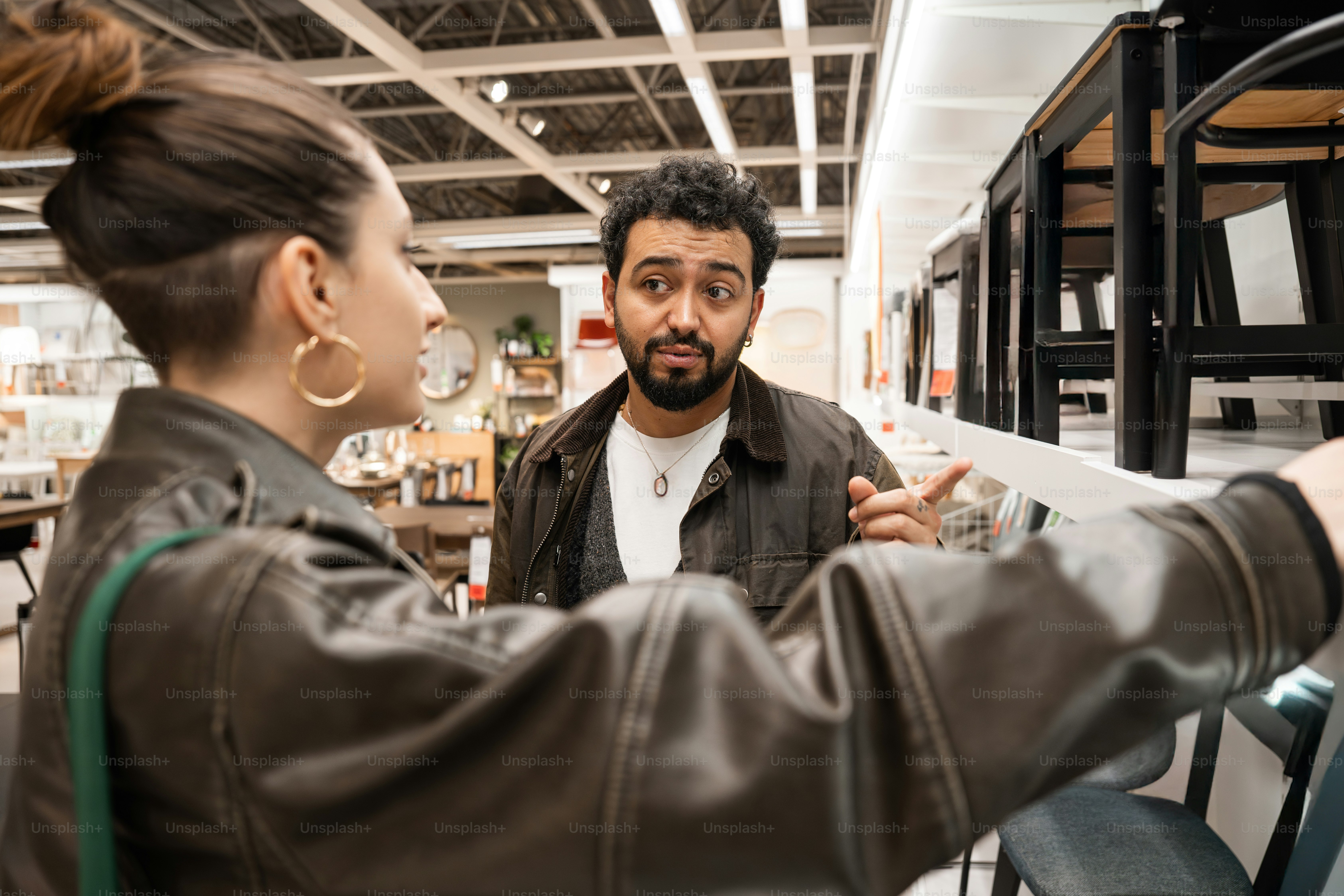 A man and a woman looking at a piece of paper