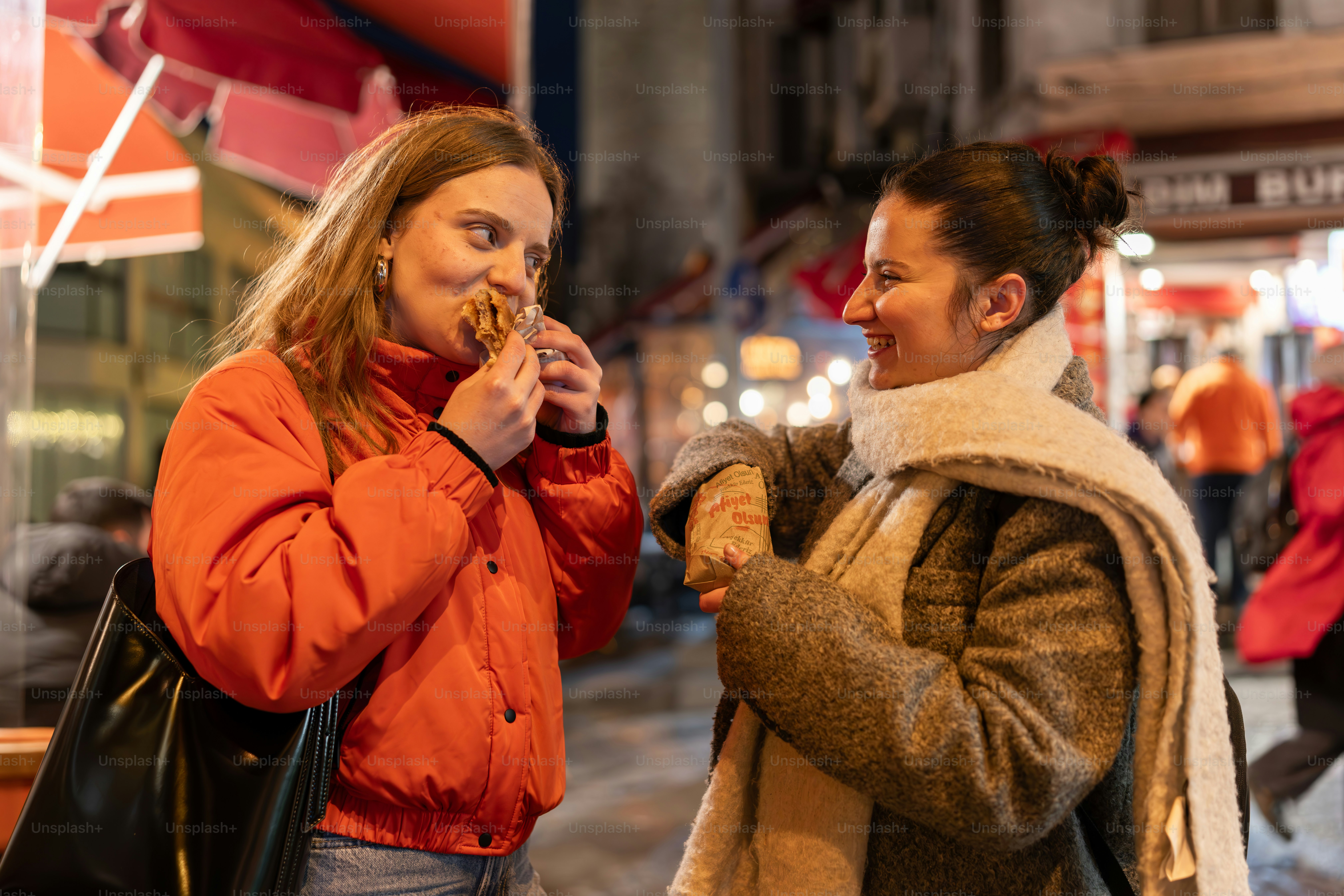 A couple of women standing next to each other