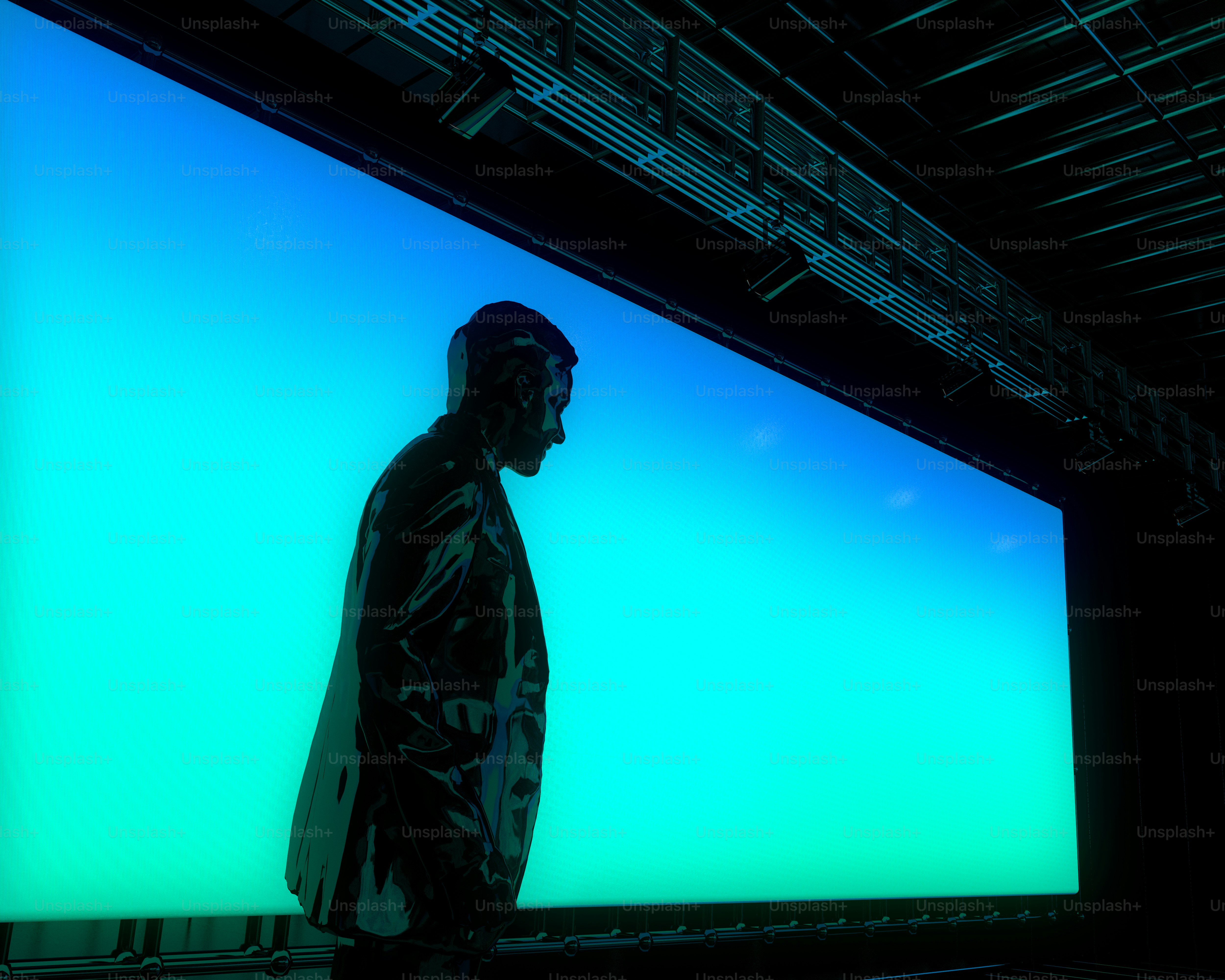 A man standing in front of a blue wall photo – 3d render Image on Unsplash