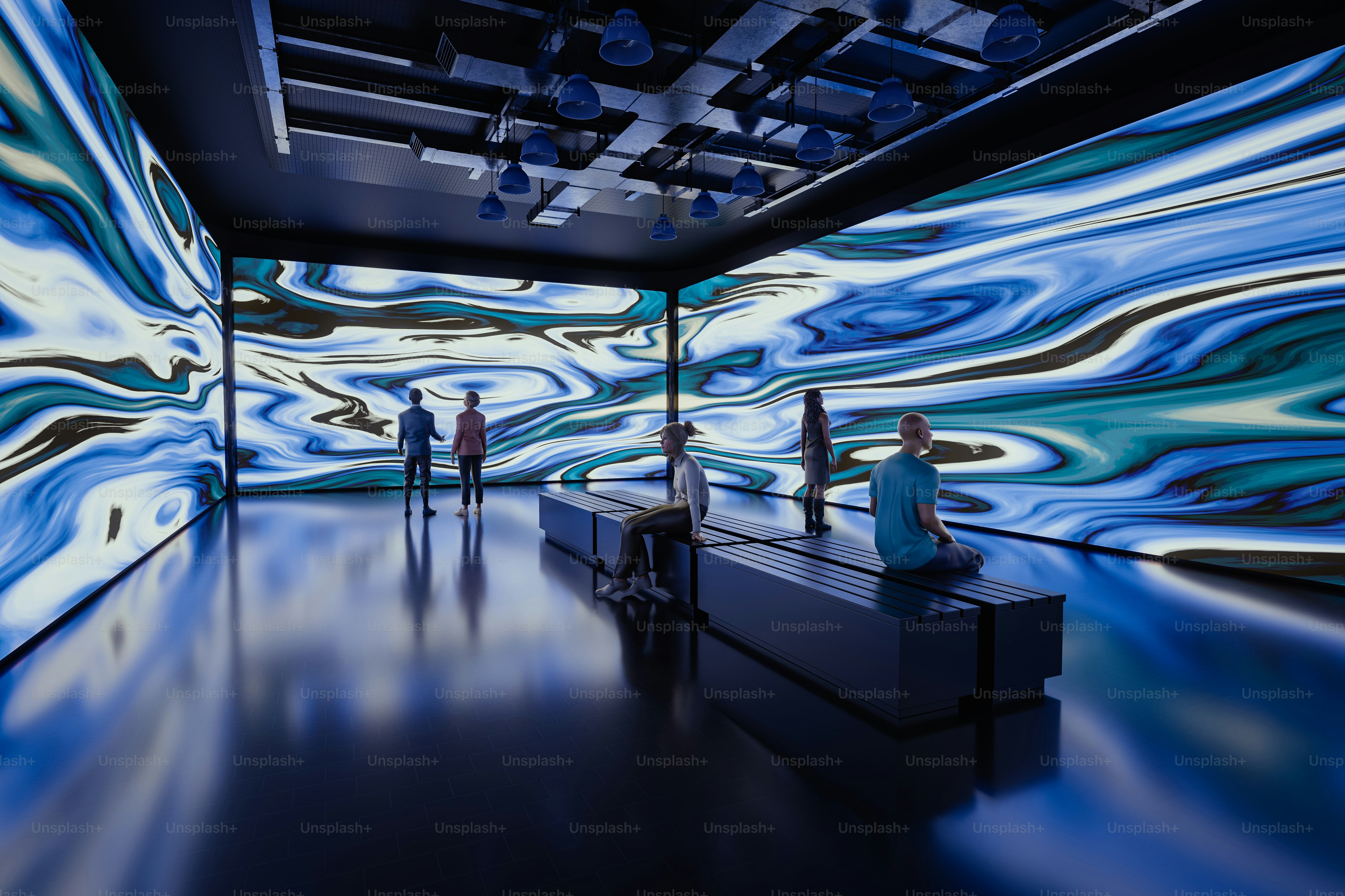 A group of people standing in front of a blue wall