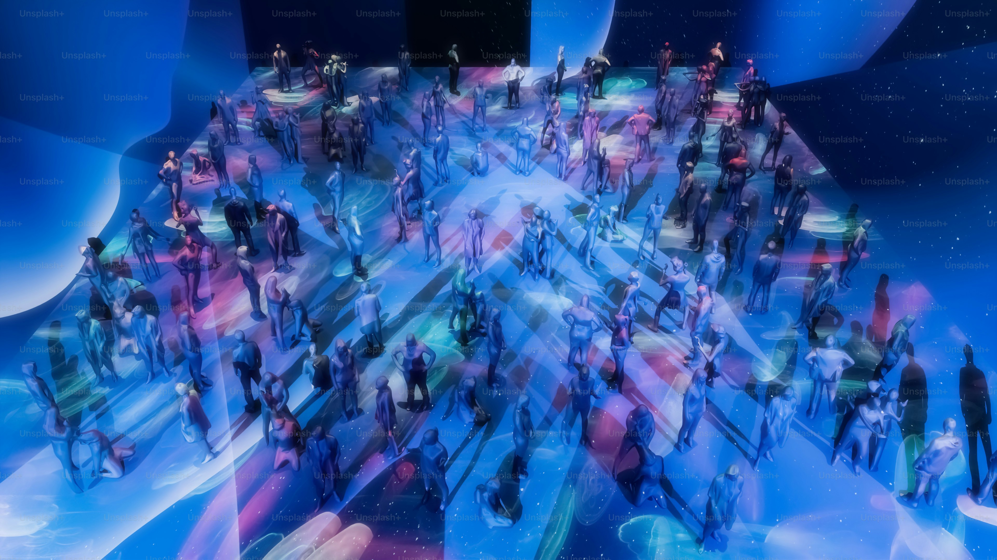 A large group of people standing in front of a blue background