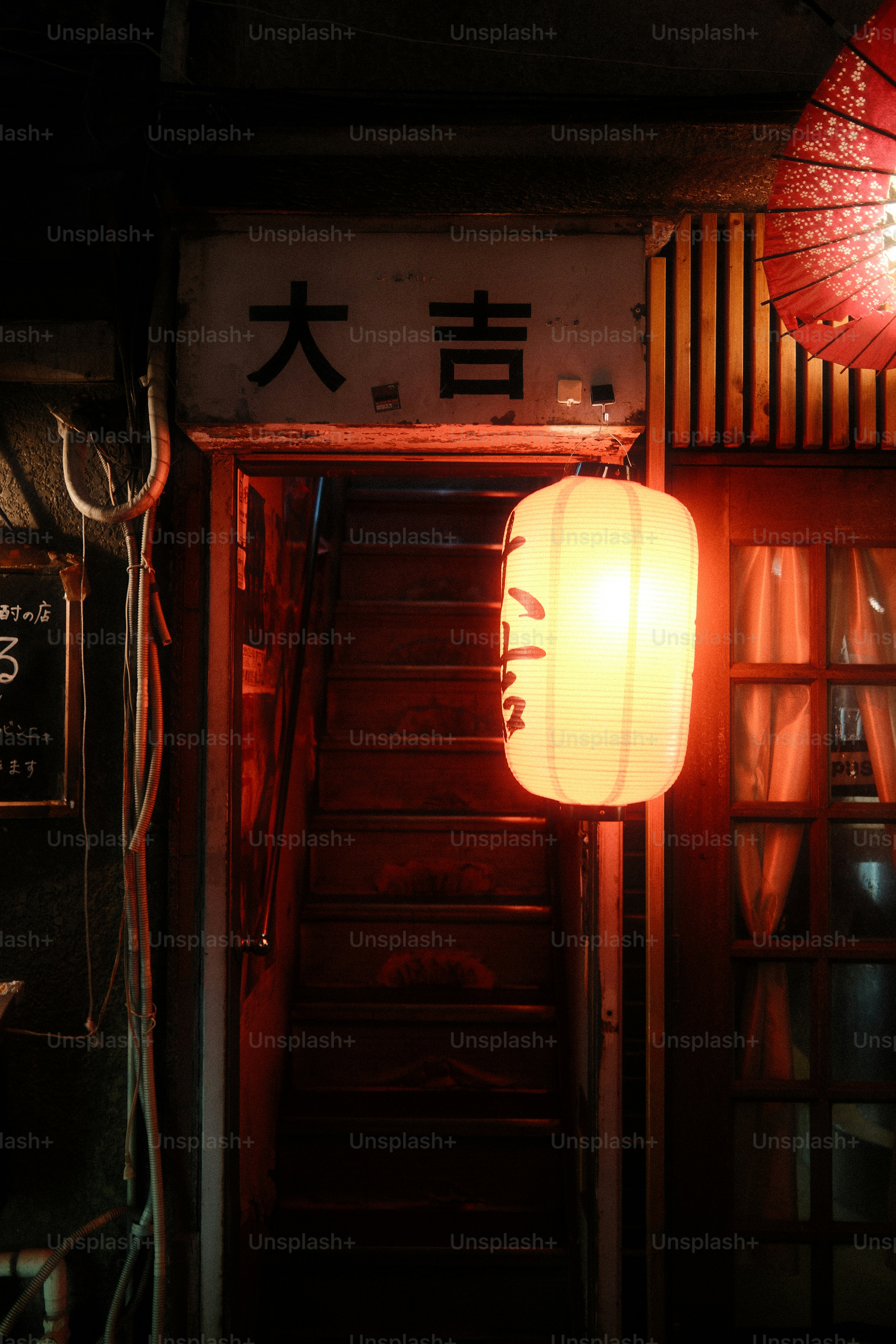 A lantern hanging from the ceiling of a restaurant
