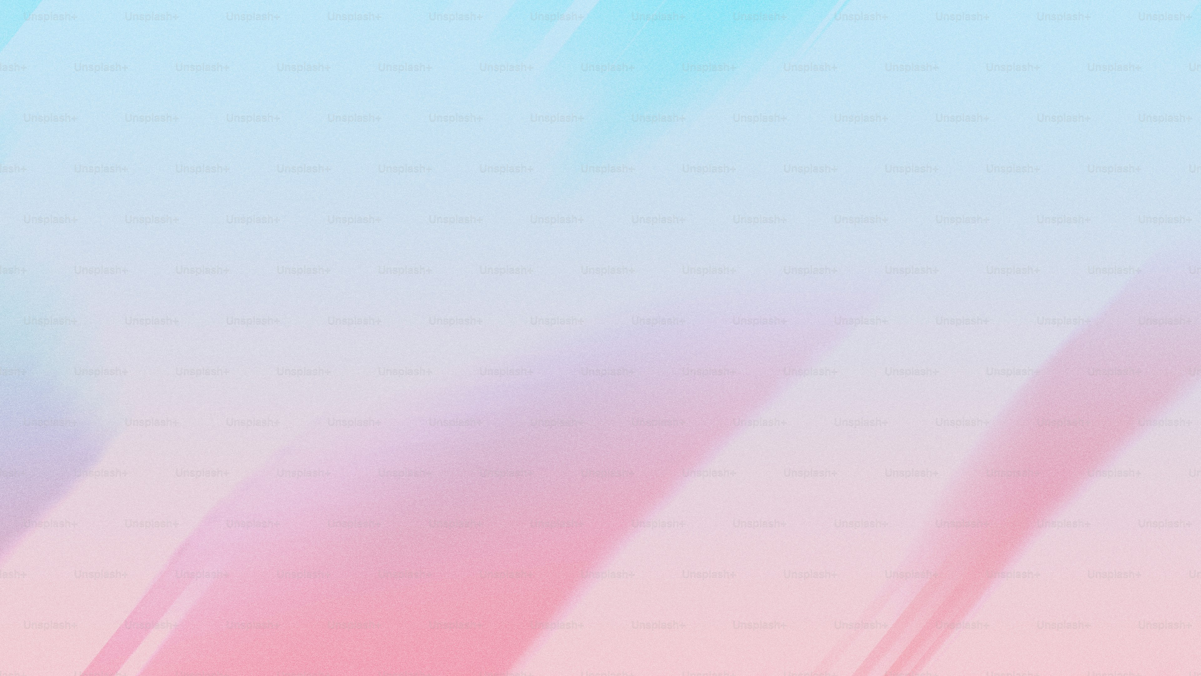 A blurry image of a pink and blue background